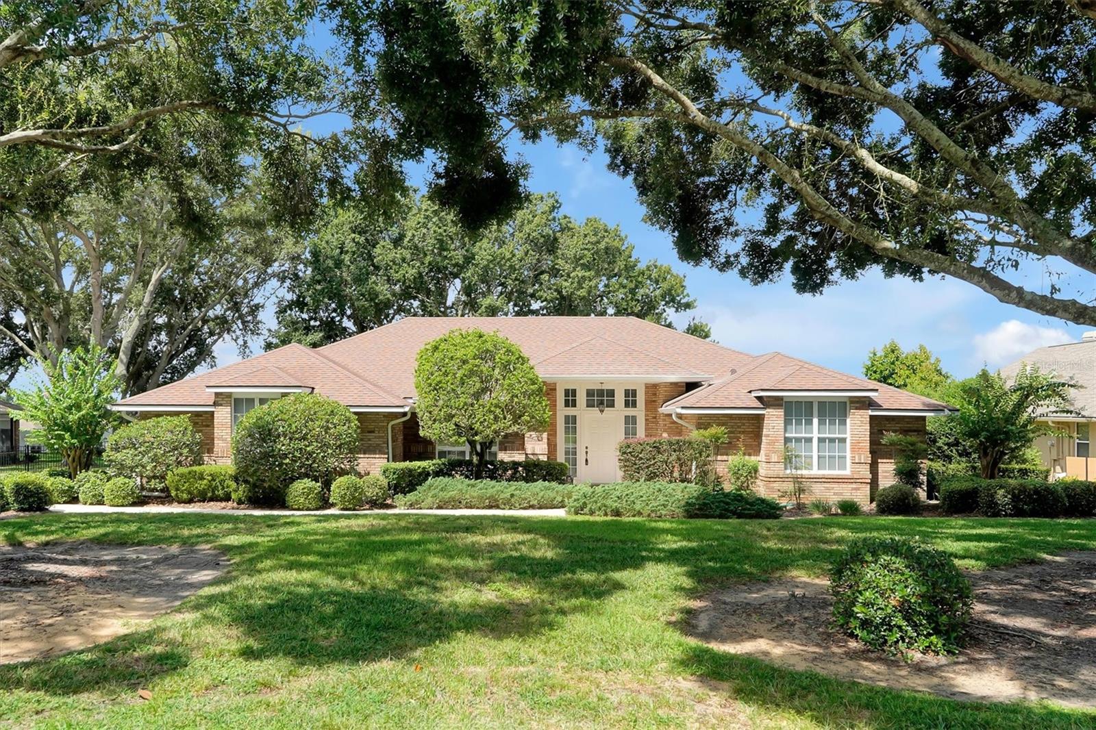 Perched atop a quiet hill in Clermont’s desirable Lake Ridge Club community, this spacious 3-bedroom, 2-bath home offers privacy, comfort, and beautiful lake views. Enjoy a view of the lake from the kitchen, family room, and pool deck, making everyday living feel like a retreat.
With more than 2,300 sq. ft. of living space, the open and functional layout provides room to grow or settle in with ease. The formal dining room, complete with a chandelier, is perfect for gatherings and special occasions. The primary suite features two walk-in closets, a private jacuzzi tub, generous space, and direct pool access—ideal for a morning swim or evening relaxation. This home also features a spacious Junior Suite, offering an oversized layout with a walk-in closet and direct access to a shared bathroom—perfect as a private retreat for guests, multi-generational living, or a second primary-style bedroom. Two additional bedrooms are well-sized and versatile for your lifestyle needs.
A specialty laundry room with utility sink and shelving adds convenience, while the attached two-car garage includes a large storage room, built-in shelving, cabinets, and a new garage door opener. Recent updates include a new A/C system (2024), sprinkler system, guttering, transferable termite bond, freshly painted pool deck and front sidewalk, new dishwasher and disposal, as well as new fans in the master bedroom and patio.
Step outside to a screened-in pool and covered patio, ideal for year-round Florida living. A partially fenced yard, mature landscaping, and deeded lake access add to the home’s appeal, whether entertaining or unwinding in your own private retreat.
Offered as-is, this home is move-in ready with plenty of potential to personalize. Located in a quiet, established neighborhood just minutes from all Clermont has to offer.