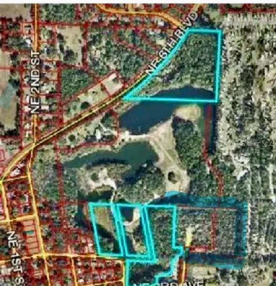 It’s hard to believe that the secret gem is located in the heart of downtown Williston! but at the turn of the century, it was a thriving rock quarry, thus the deep cliffs and the spring-fed bodies of water… great for a fishing and hunting. The serene park like setting consists of 32 acres. Street access on pave roads and utilities. Make it hey prime choice for an estate or development. Buy appointment only, no trespassing, please.