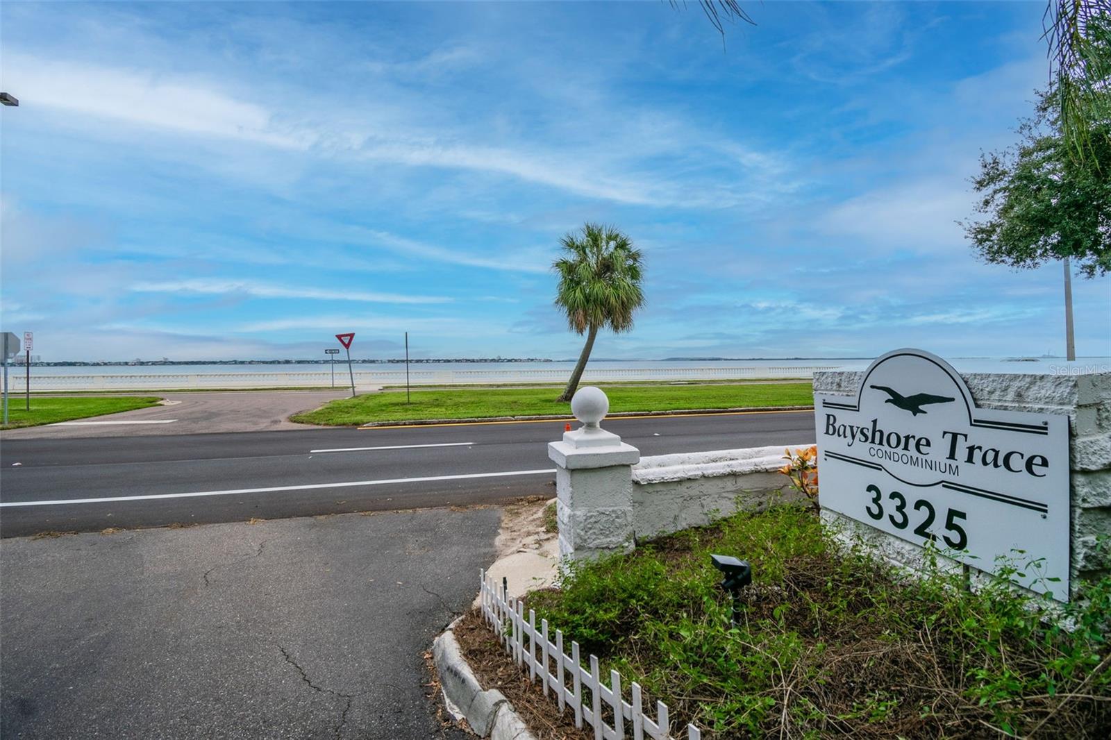 Live steps from iconic Bayshore Boulevard in this 2-bedroom, 2-bath corner unit with partial views of Hillsborough Bay. Situated on the third floor, this residence features hardwood floors throughout and a spacious layout filled with natural light. The kitchen is outfitted with stainless steel appliances, while the primary suite offers an en suite bath with a walk-in shower. A second full bath includes a tub/shower combo for added convenience. Sliding glass doors open to a covered patio where you can enjoy water views and breezes off the bay. The gated Bayshore Trace community offers peace of mind and a host of amenities, with water, sewer, trash, and laundry included in the lease. Residents also enjoy access to the sparkling community pool and barbecue grills—perfect for relaxing or entertaining. Located in the heart of South Tampa, you’ll have quick access to local restaurants, cafés, and shopping, as well as Tampa General Hospital, the University of Tampa, Water Street, and Downtown. Open parking is available for residents and guests (no assigned spaces). Available for immediate occupancy—this is Bayshore living at its most convenient.
