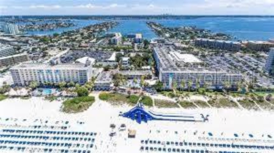 Admire the views of the lush tropical landscape and meandering waterway from your 2nd floor balcony. This recently renovated, fully furnished, two bedroom, 2 bath, 835 sq. ft. condo-hotel residence makes it easy for everyone to relax and stretch their legs. There is Plenty of room with 2 queen beds in one bedroom, 2 double beds in the other bedroom along with a comfortable sleeper sofa in the additional living room area .Enjoy the kitchenette with full-size fridge, stove-top, microwave, coffee maker, toaster and dishware There is a huge extended deck area with lounge chairs just steps by your front entry door. Excellent total turn-key rental income from the first class management rental program is already in place. Stay up to 28 days a year. Existing rental management agreement with the Tradewinds resort transfers to buyer. The Tradewinds offers over 1000' of Sandy Gulf-Front Beach on over 30 acres that will have you feel as though you are in a Tropical Paradise. Seven pools, 13 food and beverage outlets, water slides, water activities, fitness facilities and tennis courts are just a few of the very many amenities. The Tradewinds has a long established track record with hosting many weddings and conventions. What an opportunity. . This resort offers it all !