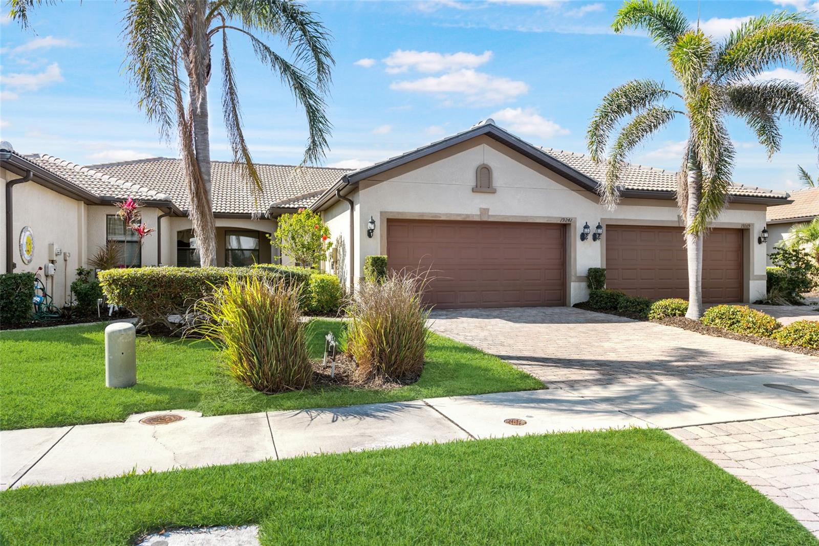 Rarely available in ISLANDWALK the LAKEFRONT MODEL VILLA HOME is now offered at a very competitive price and TURNKEY FURNISHED! This 2 bedroom, 2 bath with a den has an incredible location just steps away from all amenities such as 2 resort style pools, 2 clubhouses, fitness center, Tennis courts, 12 picketball courts, dog park, playground and miles of nature/walking trails. Not in a flood zone! The villa has tile trough out and carpet in the bedrooms. Other features are granite countertops, double pantry, wood cabinets and extra added cabinets in the kitchen, hurricane impact windows and doors! Enjoy unobstructed lake views on your ALL PAVERS EXTENDED lanai with all PANORAMIC screens (Absolute Aluminum). IslandWalk HOA includes grounds maintenance, CABLE, WIFI, amenities, and 24 hour guard. It is again all about location. The Atlanta Braves Spring Training Stadium is just a few minutes away and provides year-round events and activities. In addition, you are a short street-legal golf cart from downtown Whellen community giving you access to: a Publix supermarket, restaurants, coffee places, shopping options, gas station and more!
This villa will give you the lifestyle that you have always dreamed of. Call now!