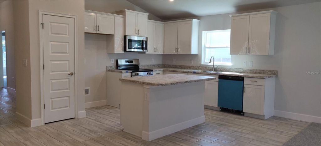 Photo of 13175 Gulf Bay Lane, Spring Hill, FL 34609 (MLS # OM707748)