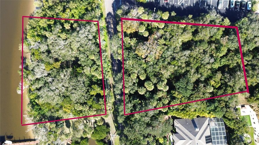 Possibilities abound on this rare 1.55 acre lot with 244' of shoreline on the beautiful Halifax River and 180' of road frontage on John Anderson Drive. In accordance with city code, the lot may be divided into 2 separate lots, if desired. Lush with greenery and native plant species, your home, duplex, vacation property, outbuildings, etc. can be easily accommodated on the .75 acre of available building space. This area is high and dry with no concern for flooding and can be easily accessed from both John Anderson Drive and Kingston Shores. This gem of a property is ready for you to begin your project with existing city water and sewage hookups, eliminating the hassles and expenses of a septic system and well. The private riverfront area holds two transferable boat lift and dock permit for any of your boating, fishing, or water pleasure needs. Relax and enjoy the extensive wildlife or simply watch the frequent Dolphin rises on the river.