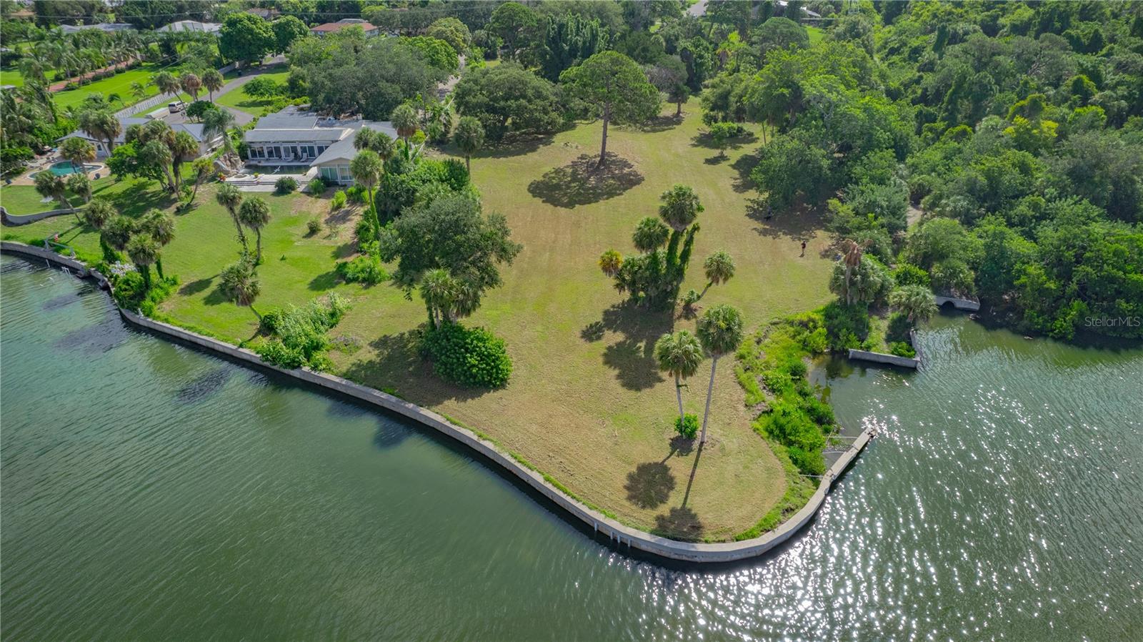 ***Price Reduced - Ready to Sell*** Welcome to your slice of paradise on this exquisite 1.08-acre waterfront lot with a seawall, located west of the trail in beautiful Sarasota, Florida. This exceptional property offers breathtaking views of Sarasota Bay, providing the perfect canvas for your dream home. Additionally, you are permitted to add an Accessory Dwelling Unit (ADU) of up to 80% of the main residence. This ADU can serve as a comfortable space for extended family visits or as a rental, complete with its own address.
Imagine waking up each day to serene water vistas and stunning sunsets that paint the sky with vibrant colours. Nestled in an upscale neighbourhood, this lot is bordered by the historic Crosley Mansion and the renowned Ringling Museum to the south, enriching your surroundings with culture and elegance. With ample space to design a custom residence tailored to your lifestyle, this large lot offers a unique opportunity to create a luxurious retreat while enjoying the tranquillity of unmatched bayfront living.
The location is ideal for those seeking a blend of natural beauty and convenient access to Sarasota’s vibrant cultural scene, exquisite dining, and pristine beaches. Don't miss your chance to own this exceptional waterfront property and build the home you have always envisioned in one of Florida's most coveted areas. Embrace the lifestyle you have always dreamed of on the shores of Sarasota Bay!
Please refer to the survey map included in the photos for more details. The property is designated as Parcel A and does not include Parcel B. Buyers are encouraged to verify the size and dimensions of the property. Tax records indicate that this lot has X500, X, and Ve designations for flood zones. The property elevation slopes upward from the Bay to the road allowing you to build a home in a non-flood zone area of the property. For more accurate information regarding the location of the X, or X500 designation, please contact the County to ensure construction outside of flood zones.