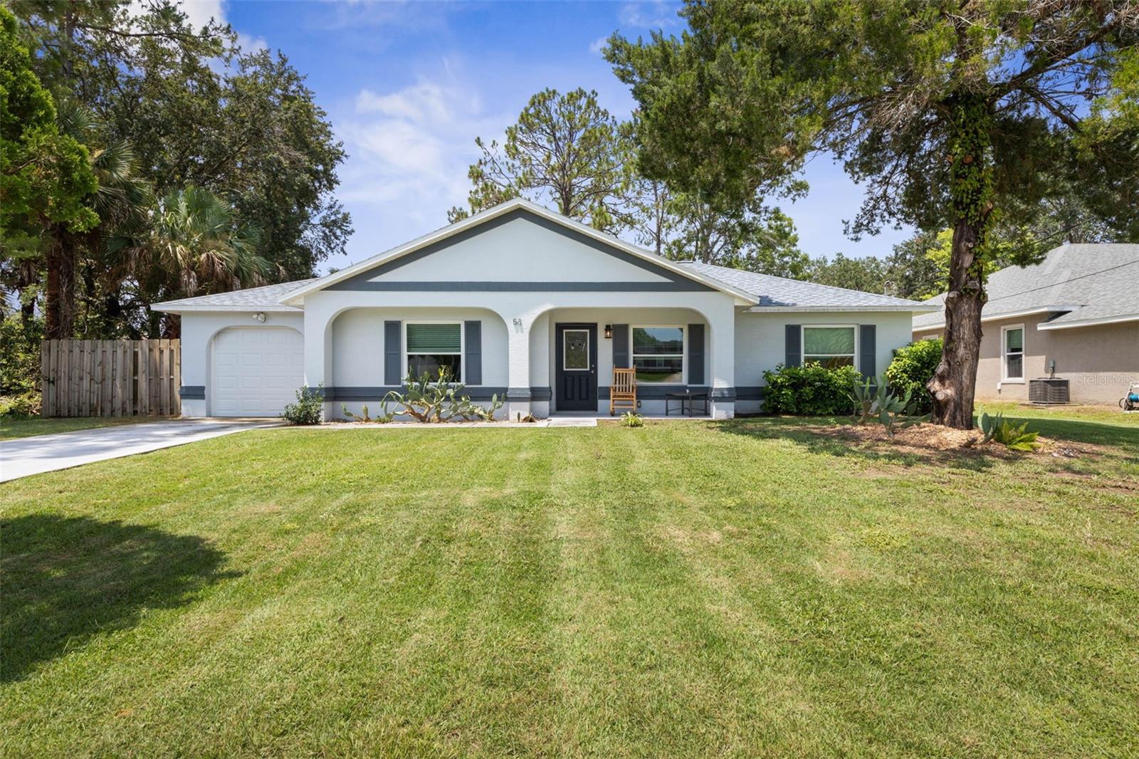 Situated in the Belle Terre section of Palm Coast, 58 Providence Lane offers a well-designed 3-bedroom, 2-bathroom home with 1,280 square feet of comfortable living space. Featuring an open concept layout, tall vaulted ceilings, and a split bedroom floorplan, this home provides both functionality and privacy. With a new roof installed in 2023 and a new HVAC system from 2022, this home offers added peace of mind and energy efficiency.
The remodeled kitchen is equipped with stainless steel appliances, granite countertops, and modern finishes—perfect for both daily living and entertaining. Tile flooring runs throughout the home, adding durability and easy maintenance. The primary suite includes a walk-in closet and a step-in shower for added convenience.
From the dining area, elegant French doors open to the patio and expansive backyard, offering plenty of space to build a pool, create a garden, or design your ideal outdoor retreat.
This home is perfectly located just minutes from Belle Terre Park, Lehigh Trail, and schools. Shopping, dining, and recreational options are also nearby, with easy access to major roads for a quick trip to the beach or surrounding areas.
Don’t miss the opportunity to make this beautifully updated home your own—schedule your private tour today!