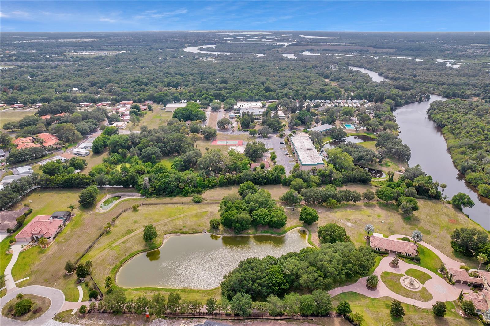 Come to the beautiful community of Winding River along the banks of the Manatee River and build your own dream home on just under 3 ACRES directly on the Upper Manatee River. Homes in this community can range anywhere from 3,000 SF to large mansions boasting over 15,000 SF and everything in between. This small community consists of 62 homes sites with walking trails and a private resident-only boat ramp directly into the Upper Manatee River. With 123 feet of direct river frontage, you will enjoy gorgeous river views off the back of your property. Enter onto your property from a cul de sac of just 4 or 5 other homes at the back of the community and you will enjoy an incredible amount of peace and serenity as you settle in for the evening. Please note that a dock cannot be permitted on this lot.
