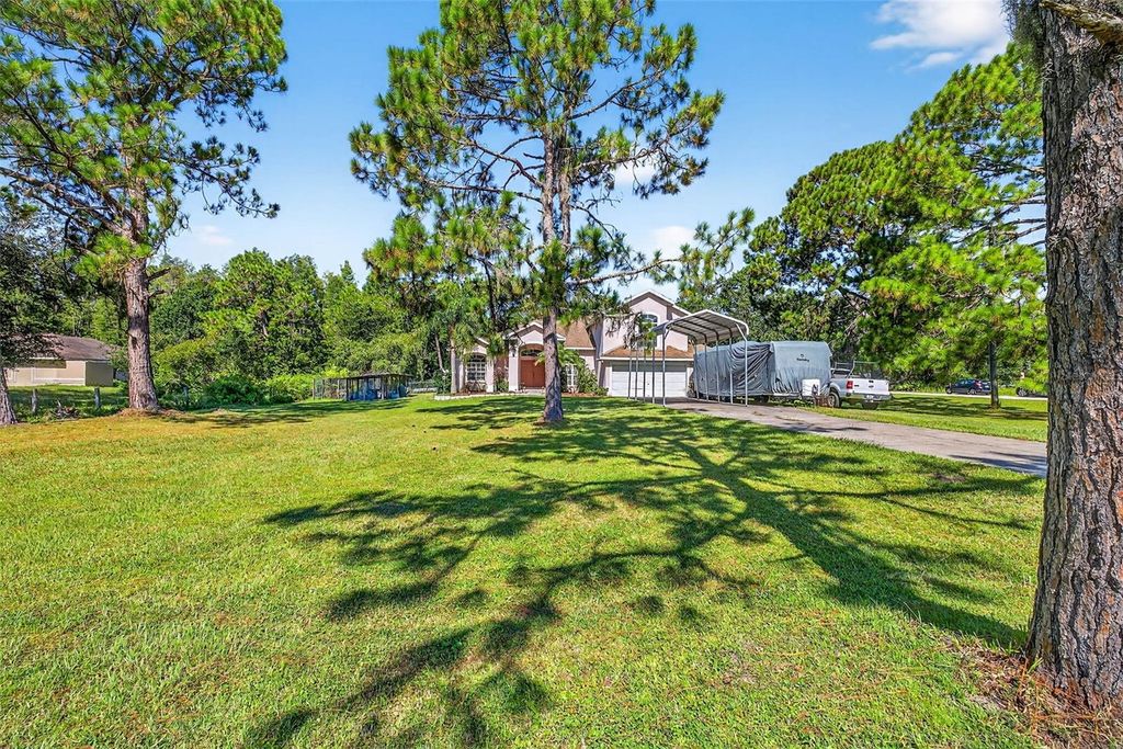 Photo of 7911 Pine Lands Drive, Wesley Chapel, FL 33544 (MLS # TB8424596)