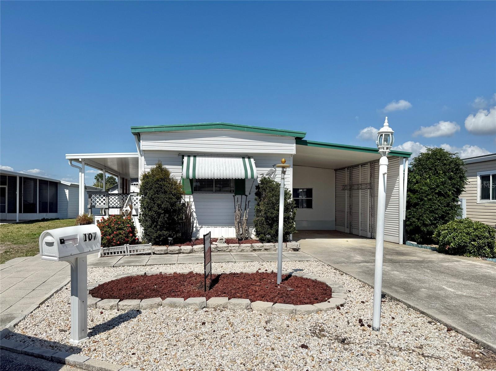Welcome to your dream retirement or seasonal home in 55+ Caribbean Isles Residential Cooperative! This charming WATERFRONT property offers resort-style living without the hassle of lot rent. With a low monthly maintenance fee of just $242, you'll enjoy access to exceptional amenities, professional management, and an array of engaging social activities. With a split floor plan, each of the bedrooms are at opposite ends of the home for maximum privacy when guests visit. The kitchen has updated cabinets, solid surface countertops, a dishwasher, microwave, double sinks and a double door refrigerator with ice maker. The washer and dryer are located in the laundry room adjacent to the screened in lanai. On the other side of the home you'll find an open air porch...because who wants to stay inside all day? Drop your boat at your dock for a quick trip down the canal to Tampa Bay. Or store your boat in the RV/Boat storage lot for a more than reasonable rate of $120 to $250 annually. When you are not out boating or fishing, the community has activities and events year around. Outside the clubhouse you'll find a heated pool, and inside you will find a library, craft and game rooms, and a large meeting area for the dinners and dances which are sponsored throughout the year. Activities include bingo, card games, an annual talent show, Penny Social, guest entertainers, holiday dinners prepared in the full service kitchen, and live band performances. Caribbean Isles is located midway between Tampa/Saint Petersburg and Sarasota/Bradenton, on the west coast of Florida. Head in any direction from the community and you will find beaches, restaurants, shopping, museums and tourist attractions. Stay here for the time of your life!