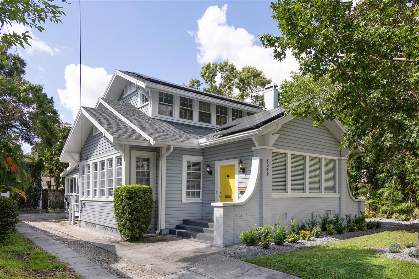 Palma Ceia mixed use LIVE/WORK space located on prime residential street. Zoned RO-1 with great visibility, walkability and parking for this unique and charming space, all in pristine condition directly across from Palma Ceia Country Club. This home has operated as a beautiful photography studio and has versatility for any office space with all the comforts of home. With soaring ceilings and wide open spaces upon entry, the foyer & living room offer a picture perfect space for client consultation with original tile & hardwood flooring. Coffered ceilings and built in bookshelves highlight the charm you expect in this location. The kitchen has been remodeled with granite counters, stainless steel appliances, wood cabinets, ample pantry space and separate indoor laundry area. The dining room
doubles as a conference room with built-in cabinets and rear entrance. The first floor finishes off with 2 bedrooms that can act as private offices with gorgeous original hardwood floors. There is a full bath and a powder room on the first floor. Head upstairs and find another bedroom with hardwood floors, and an extra large bedroom/showroom with another shared powder room. The roof is new with completely paid off solar panels that keep your utility bills very low. AC, electric and plumbing are all up to date. There are 3 entry points of the home offering the ability to share work space, or live and work with privacy in Tampa's most central corridor in Palma Ceia. The back yard has carved out perfectly landscaped extra parking spaces. Tesla charging station. Zoned for Mitchell Elementary, Wilson Middle, and Plant High schools. Located off MacDill Ave, making catching commuting routes is easy. It isn't often that a home offers so many possibilities in this location and you should not wait- come see it for yourself!