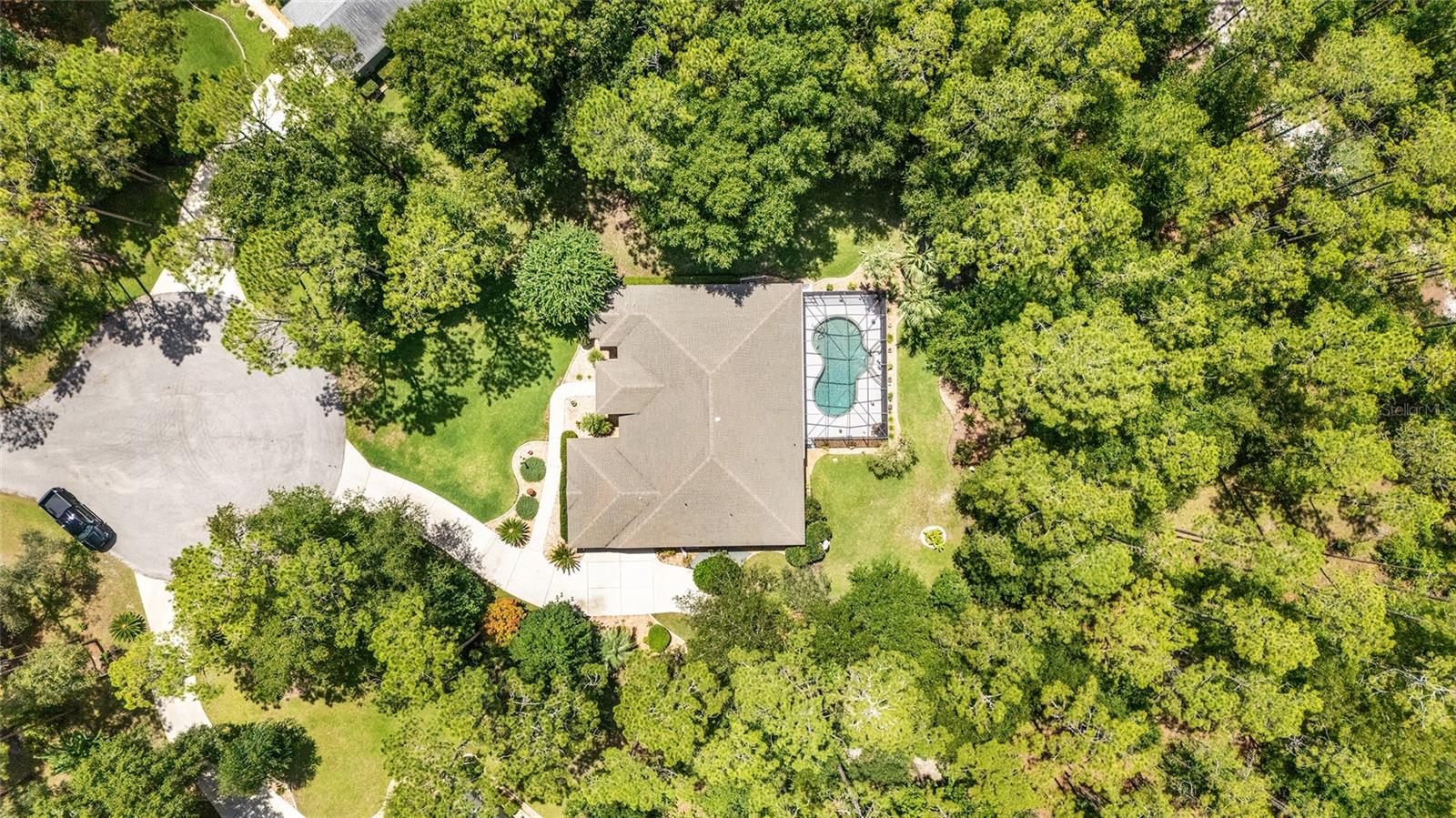 Live Where the Forest Meets the River – Welcome to Rainbow Springs Woodlands, a community known for spacious landscapes around its homes and a very rare opportunity to have private access to the Rainbow River! Tucked away on 2 serene acres in the Rainbow Springs Woodlands, this stunning 3-bedroom, 2-bathroom pool home offers the kind of peaceful, nature-connected lifestyle most only dream about. Inside, you’ll find a comfortable office upon entry, a warm and welcoming layout, a well-appointed kitchen featuring Corian countertops and a central island, and plenty of room to gather. One of the bedrooms has been expanded into a billiards/game room—perfect for entertaining, but easily convertible back to a formal bedroom if desired. The spacious primary suite is a true getaway, complete with French doors that open to your private pool oasis. Once you step outside to the pool area, you will love the expansive and lush forest backdrop, a sparkling pool with a cascading fountain, and an oversized lanai with a full summer kitchen—ideal for holiday grilling or alfresco dining, or long, lazy afternoons by the water. Most exciting about this home is also its private access to the legendary Rainbow River—one of Florida’s most breathtaking natural treasures. Imagine launching your kayak or paddleboard into crystal-clear spring-fed waters, swimming with otters, or just drifting under the cypress trees as the world fades away. Residents also enjoy top-tier amenities, including a community pool, tennis and pickleball courts, a clubhouse with billiards and game rooms, and the lively Cheers Restaurant, where locals gather for live music every Friday and Saturday night. All of this, just a short drive to restaurants, shopping, and grocery stores, within 30 minutes to Ocala (and the World Equestrian Center), 45 minutes to Gainesville, and under 2 hours to the Tampa or Orlando theme parks, airports, and some of Florida’s most popular beaches. Discover the magic of Rainbow River living—schedule your private tour today!