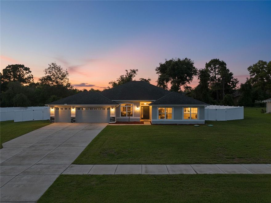 One or more photo(s) has been virtually staged. Welcome to this stunning 4-BEDROOMS, 3-BATHROOMS home with a dedicated OFFICE/FLEX space behind elegant double doors, offering the perfect blend of functionality, comfort, and modern style. Situated on a spacious HALF-ACRE lot in the highly desirable Wyndsor Place community, this home boasts a thoughtfully designed open-concept floor plan with a 3-CAR GARAGE and extended driveway. The heart of the home is the impressive CHEF'S KITCHEN featuring GRANITE countertops, TWO OVERSIZED ISLANDS, a breakfast bar, abundant cabinetry, an enormous WALK-THROUGH PANTRY, and an abundance of counter space for entertaining and everyday living. A large picture window floods the kitchen with natural light, while recessed lighting throughout the home creates a bright and welcoming atmosphere. The expansive living room showcases VAULTED CEILINGS and a beautiful shiplap accent wall with an ELECTRIC FIREPLACE and WOOD MANTEL, creating a warm focal point for gathering with family and friends. A FORMAL DINING ROOM provides additional space for hosting holidays and special occasions. The private primary suite is a true retreat featuring TRAY CEILINGS, generous dimensions, and a spa-inspired ensuite bathroom complete with dual vanities, a soaking tub, separate walk-in shower, and spacious walk-in closets. BRAND NEW LUXURY VINYL PLANK WOOD LOOK FLOORING flows throughout the main living areas, with plush carpeting reserved for the bedrooms for added comfort. FRENCH DOORS with built in blinds lead to the backyard oasis where you'll find a VINYL FENCED YARD, FIRE PIT area, and plenty of room to enjoy outdoor living on your half-acre homesite. Additional highlights include a WELL-DESIGNED LAUNDRY ROOM/MUD ROOM with convenient access, abundant storage, large windows throughout, and a community featuring SIDEWALKS perfect for walking and enjoying the neighborhood. Conveniently located near the Suncoast Parkway, offering an easy commute to Tampa, shopping, dining, schools, and all the amenities Florida's Nature Coast has to offer. This exceptional home truly checks every box--space, style, location, and functionality.