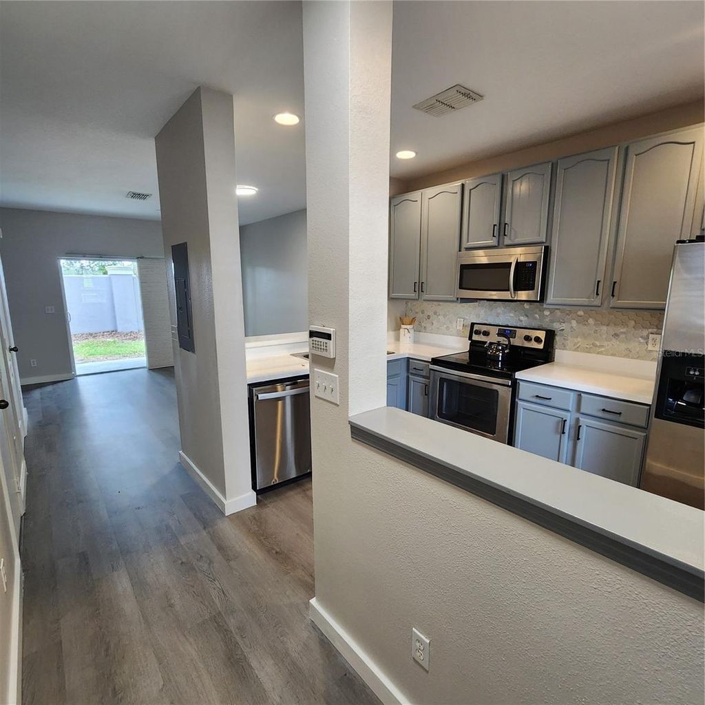 Photo of 10672 Savannah Wood Drive #101, Orlando, FL 32832 (MLS # O6387334)