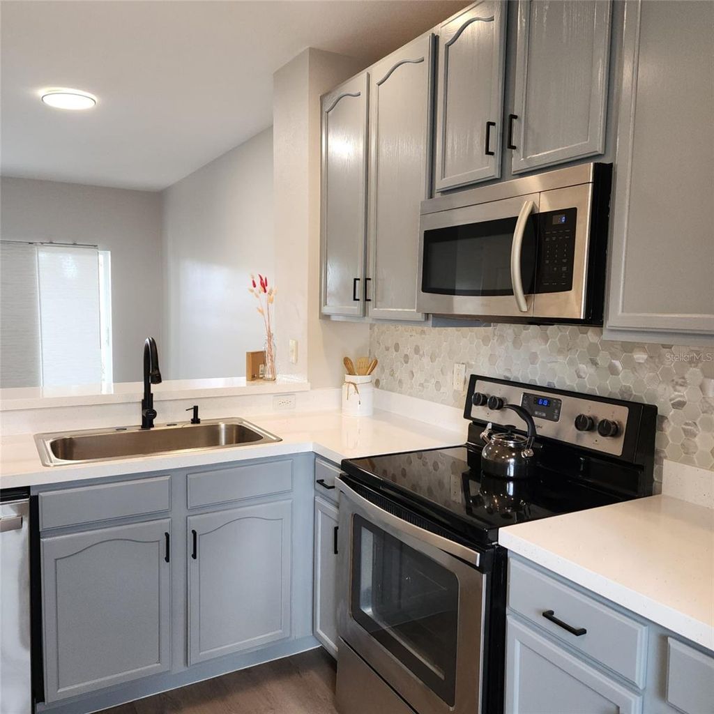 Photo of 10672 Savannah Wood Drive #101, Orlando, FL 32832 (MLS # O6387334)