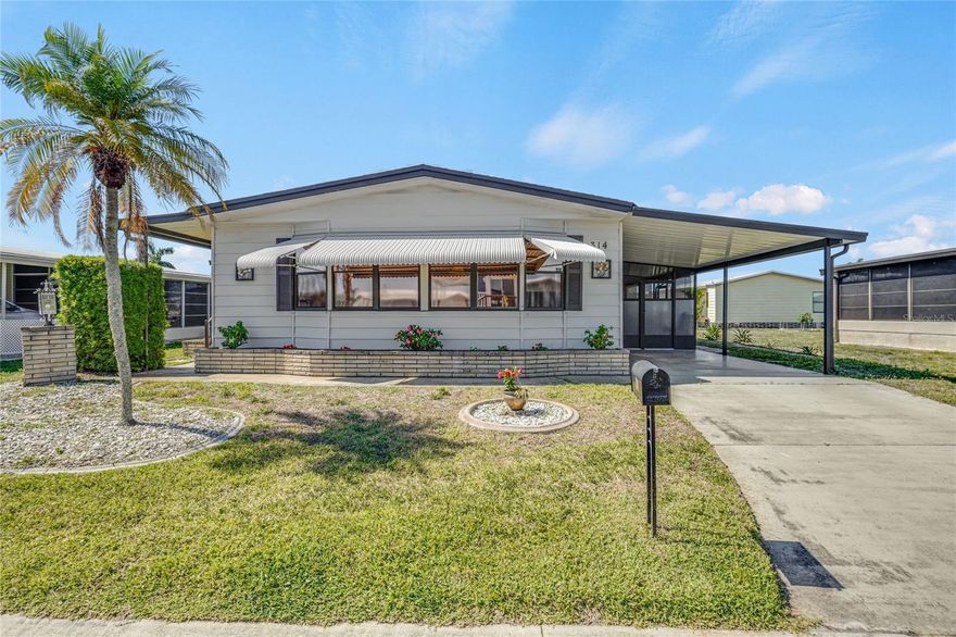 If you are looking for a furnished home in a 55+ waterfront community with plenty of space to spread out and enjoy Florida living, this 2BR/2BA home in Harbor Isles is a must-see. Offering 1,482 sq. ft. of interior space plus an enclosed lanai and additional screened area, this home provides plenty of room to relax and entertain. The spacious living room features windows spanning across the front of the home, while the oversized kitchen offers abundant cabinetry, workspace, and pantry storage. Dining options include both a separate dining area with built-in hutch and a dinette/family room with wet bar for casual meals and game nights. Sliding glass doors near the kitchen open to the lanai, creating ideal indoor-outdoor living. A large primary suite offers a private retreat with newer windows and a generously sized bathroom, while the split-bedroom floor plan allows guests added privacy with direct access from the second bedroom to the hall bath. Recent updates include a new shingle roof and water heater in 2023, new A/C in 2024, a vapor barrier update in 2026, plus some updated flooring. A large storage shed located under the carport houses the washer and dryer. An older 16’ Glaspro boat with motor and trailer is available to the buyer at no additional cost. Harbor Isles is a gated, land-owned, pet-friendly community offering marina access to the Myakka River, and the Gulf, along with an expansive heated pool and spa, large clubhouse, fitness center with showers and sauna, billiards, tennis, bocce ball, shuffleboard, kayak launch, marina, and fishing opportunities. An active social calendar with clubs, gatherings, and community events offers plenty of opportunities to socialize and connect. The low HOA fee of just $196/month makes this package even more attractive. Conveniently located near shopping, dining, golfing, spring training baseball, quality healthcare, and beautiful Gulf beaches, this home offers plenty of living space, recent improvements, and access to fantastic community amenities for either year-round or seasonal living. Call today to schedule your private showing!