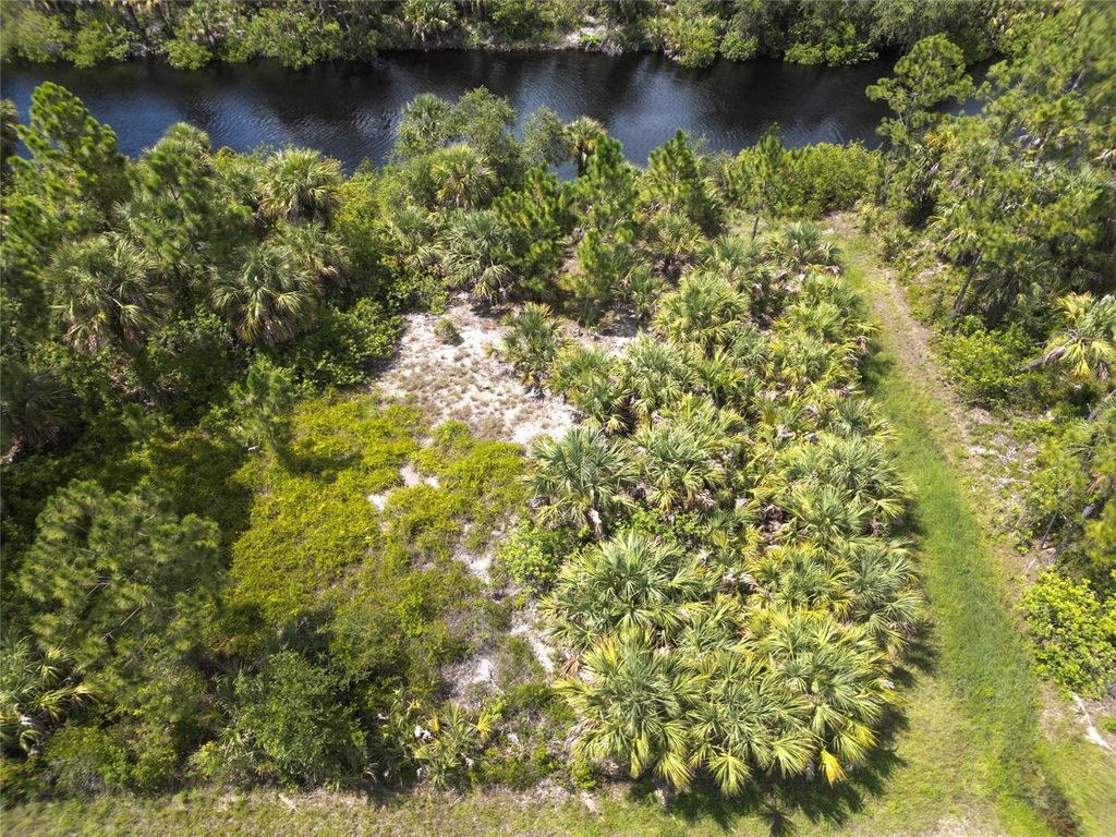 Photo of 14280 Mcclellan Avenue, Port Charlotte, FL 33953 (MLS # O6326389)