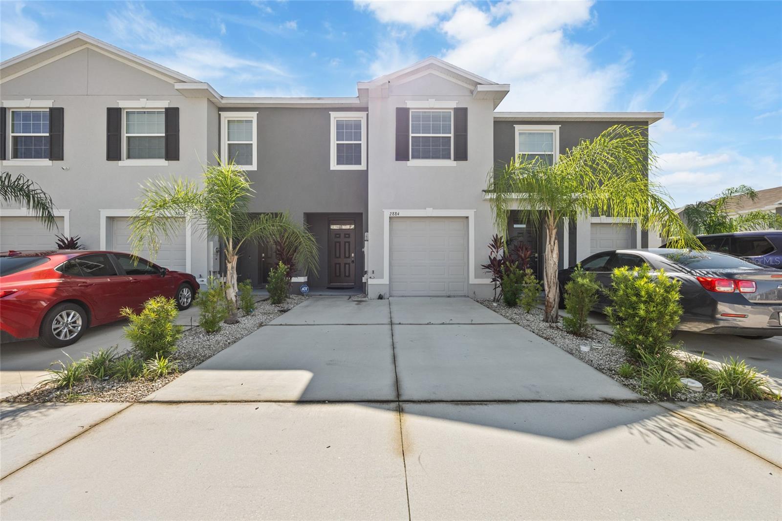This like-new townhouse, built in 2022, is located in the highly desirable Summerstone community of Wesley Chapel, FL, offering exceptional value. It features stainless Whirlpool appliances, a large granite island with ample space for meal preparation, an oversized lanai, a one-car garage with a double-wide driveway for additional parking, and smart home features. The open floor plan seamlessly integrates the living, dining, and kitchen areas, making it ideal for entertaining and everyday living. The kitchen serves as a focal point with its spacious granite island, providing abundant space for meal preparation. Additional storage space is available under the stairs, offering extra room for belongings. The community boasts resort-style amenities, including a luxurious pool, shaded cabana, open play area, and half basketball court for active living. Conveniently situated near SR-56, this home offers quick access to premier shopping locations such as The Grove and Tampa Premium Outlets, excellent schools, healthcare facilities, and the Wesley Chapel Sports Complex.