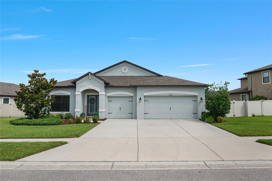 Welcome to the Exceptional Barcello “B” Pool Home, situated on a oversized pond view homesite in Talavera! Discover Florida living at its finest in this move-in ready 4-bedroom, 3-bathroom saltwater pool home with 3-car garage ideally located in the highly sought-after Talavera community. Nestled on an oversized homesite, just under 1/4 acre, this home boasts a freshly painted exterior(February 2026), breathtaking pond views, pristine landscaping, elegant coach lighting, a glass-inlay front door, and a charming front porch that creates an inviting first impression. Step inside to a grand foyer with brick-pattern tile that flows seamlessly into the open-concept living areas. A flexible formal dining room or seating area sets the tone for elegant entertaining. At the heart of the home, the gourmet kitchen impresses with 42” upper cabinets with crown molding, granite countertops, a large center island with pendant lighting, stainless steel appliances, closet pantry, and a casual eat-in café overlooking the backyard oasis.Enjoy panoramic views of the screened-in saltwater pool and tranquil pond from the spacious family room, filled with natural light. The adjacent dining area features an upgraded chandelier, adding character and charm.The west wing includes two generous secondary bedrooms with ample closet space, served by a beautifully updated full bathroom featuring a granite-topped vanity and a dedicated linen/storage closet. A fourth bedroom with a nearby full bath—also upgraded with granite and additional storage—is perfect for guests or multi-generational living. The laundry room offers convenience and style with upgraded cabinetry, a butcher block counter, and full-height backsplash tile. The garage is equally impressive, featuring epoxy flooring, utility sink, mounted racks, a hybrid electric water heater, electric vehicle charger and a side pedestrian door. The luxurious owner’s suite is a serene retreat with wood-look luxury vinyl flooring, tray ceiling, and abundant natural light. The ensuite bath features dual sink vanity with granite, a large garden tub with decorative listello tile, a walk-in shower with floor-to-ceiling tile, private water closet, and a spacious walk-in closet with built-in organizer system. Step outside to your private fully fenced backyard paradise. The 26x10 trussed lanai opens to a spacious paver patio and a stunning saltwater pool (built in 2022) with in-pool lighting, sheer water features, built-in bench, and a scalloped edge design—all overlooking the peaceful pond. Whether entertaining or enjoying quiet evenings, this outdoor space is designed to impress. Additional features include: in-wall pest system, termite bond, gutters, and professional landscaping. Talavera community amenities include a resort-style pool, splash pad, clubhouse, basketball and tennis courts, and weekend food trucks. Ideally located just north of Land O’ Lakes with easy access to US-41, SR-52, and the Suncoast Parkway. Close to shopping, dining, and top-rated schools. Don’t miss this rare opportunity—schedule your private showing today!
