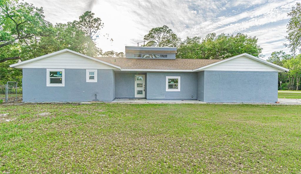 Photo of 1440 Walker Road, Lakeland, FL 33810 (MLS # TB8483201)