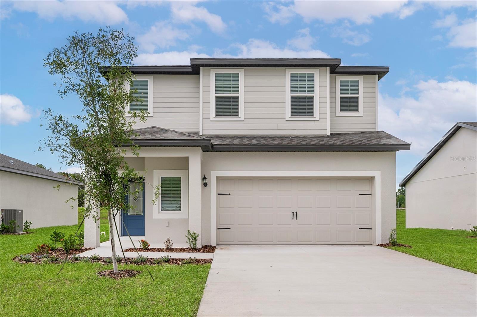 Under Construction. Welcome to the Driftwood floor plan in the serene Tula Parc community of Astatula. This spacious two-story home offers four bedrooms and 2.5 bathrooms, providing ample space for family and guests. The heart of the home features a chef-ready kitchen equipped with brand-new Whirlpool appliances, granite countertops, and a large kitchen island, perfect for meal preparation and gatherings. The open-concept design seamlessly connects the family room, dining area, and covered patio, creating an ideal space for entertaining. Upstairs, you’ll find a versatile loft area, suitable for a home office or playroom. The private master suite boasts a massive walk-in closet and a full bathroom with a dual-sink vanity and step-in shower. Additional highlights include a welcoming foyer, separate dining room, and gorgeous front yard landscaping that enhances the home’s curb appeal. Residents of Tula Parc enjoy proximity to outdoor activities such as hiking, wildlife exploration, and golfing, with Little Lake Harris just minutes away. Don’t miss this opportunity to own a beautiful home in a tranquil community!