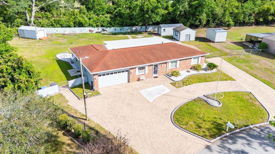 Welcome to a rare opportunity on highly sought-after Ramblewood Lane in Brandon! Nestled on a spacious and fully usable 0.6-acre lot, this well-maintained 1968 home offers 2,208 square feet of comfortable living in a charming, established neighborhood with no HOA.
Inside, you’ll find a versatile layout featuring 3 bedrooms, 2 bathrooms, a dedicated office, and a large game room—perfect for working from home, entertaining, or creating the ultimate flex space to fit your lifestyle. The home blends classic character with thoughtful updates, including a new HVAC system (2023) and all-new ductwork (2024) for improved efficiency and comfort.
The kitchen is equipped with natural gas, which also powers the tankless water heater and a whole-home generator, providing peace of mind and energy reliability year-round. While connected to city water, the property also features a private irrigation well (installed in 2015)—a valuable and cost-saving bonus for maintaining the lush grounds.
Step outside and enjoy the expansive screened-in back porch—ideal for relaxing evenings or hosting gatherings. The pavered driveway adds curb appeal, while the property truly shines with three powered sheds, offering incredible flexibility. One shed includes 50 AMP RV service, making it perfect for RV hookup, a workshop, home office, or even a private retreat space.
With so many upgrades and features, this property is a must-see—be sure to review the attached list for a full breakdown of improvements. Homes like this, with space, functionality, and location, don’t come around often!