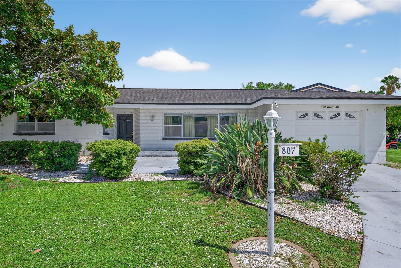Updated 2BR/2BA Home in Tangelo Park – No HOA or Deed Restrictions!
This beautifully updated single-family home in the desirable Tangelo Park neighborhood offers 2 bedrooms, 2 bathrooms, and freedom from HOA fees or deed restrictions. Inside, you’ll find luxury vinyl plank flooring throughout, with tile in the fully renovated second bathroom. The modern kitchen features granite countertops, a stylish tile backsplash, and 2023 stainless steel appliances (Samsung fridge, stove, and dishwasher + Frigidaire microwave). Other upgrades include a 2021 AC, 2025 hot water heater, front-load washer/dryer, and new ceiling fans with remotes. The exterior boasts refreshed landscaping with low-maintenance seashell beds and removed overgrowth. Move-in ready with peace of mind and modern comfort!