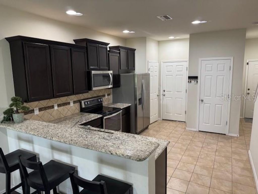 Photo of 8723 Turnstone Haven Place, Tampa, FL 33619 (MLS # TB8412436)