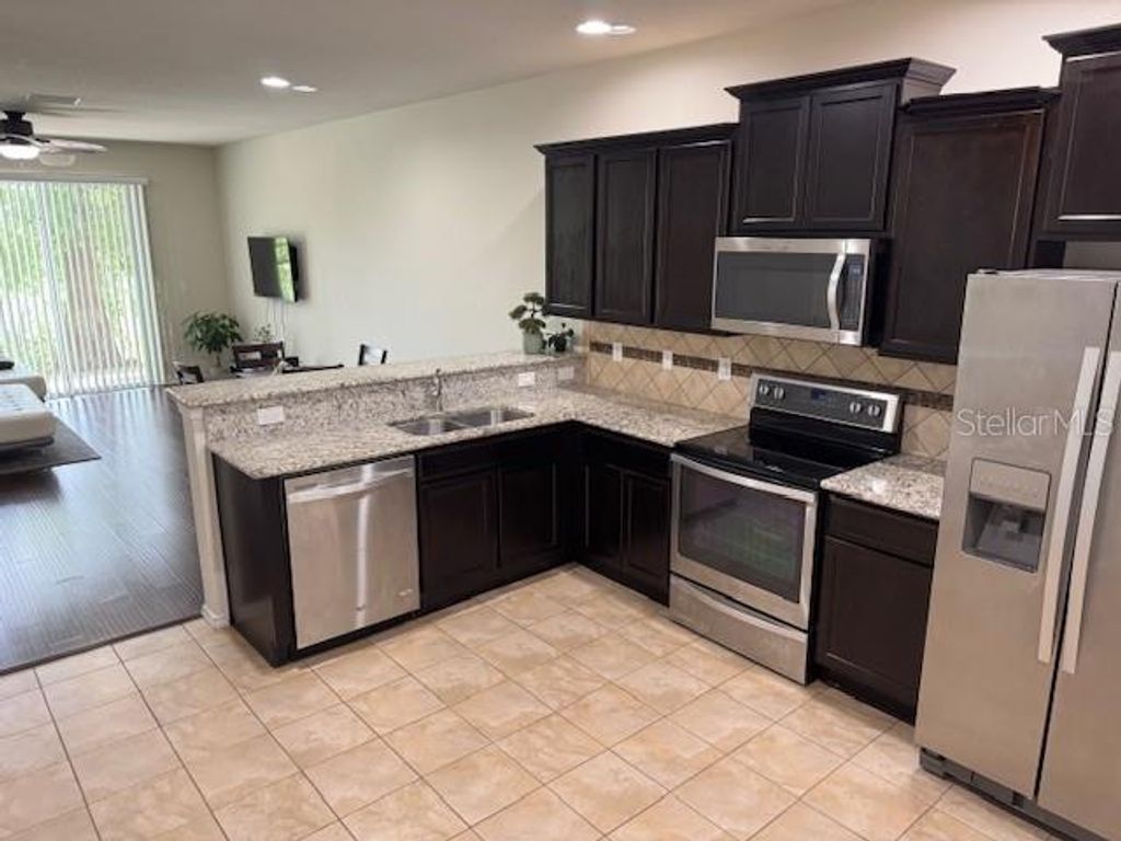 Photo of 8723 Turnstone Haven Place, Tampa, FL 33619 (MLS # TB8412436)