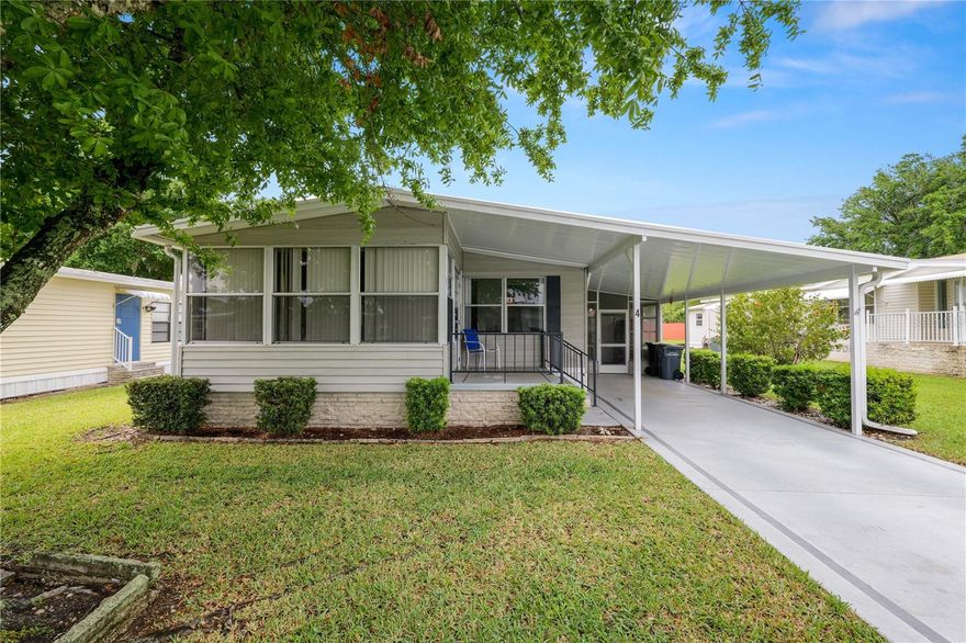 Welcome to easy living in Citrus Woods, an active 55+ community!  This well-maintained double-wide home with a NEW ROOF and NEW AC offer peace of mind, comfort, space, and flexibility!

Inside, the home offers a spacious living room that flows into the dining area and kitchen, creating a comfortable and functional layout. The living room opens to the enclosed Florida room, bringing in natural light and extending the living space even more.

The home features two bedrooms, each with walk-in closets, along with two bathrooms. The generously sized primary suite includes two adjoining bonus rooms—ideal for a potential third bedroom, craft space, expanded closet, or additional storage. The home is offered unfurnished, providing a great opportunity to personalize, while vintage details throughout add charm and a nostalgic touch.

Additional features include an enclosed porch, laundry room and a carport, offering everything you need in one beautiful home.

Citrus Woods fosters a vibrant lifestyle where neighbors connect at the heated pool, community center, and frequent social events—all with the added peace of mind of an on-site sheriff’s station. This home perfectly balances comfort and convenience, sitting just minutes from premier shopping, dining, medical care, and the heart of downtown. 

Schedule your showing today!