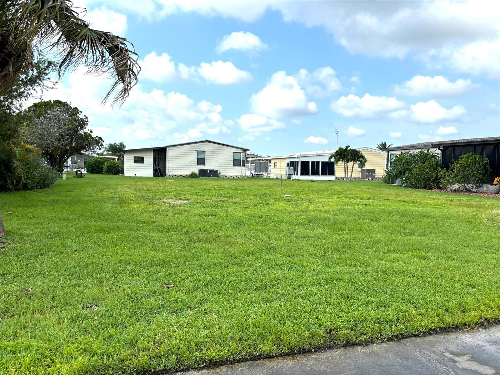 Vacant lot in a vibrant 55+ community! La Casa offers the ultimate Florida lifestyle. We have 974 homes nestled among a variety of native trees with spacious common grounds surrounding our eight lakes. Located between Sarasota and Fort Myers, this is a boater's dream with access to the Gulf of Mexico. It is convenient for shopping, sightseeing, golfing, fishing, and boating, as well as all the culture and elegance the Southwest Florida area is noted for. La Casa may have the best pools in the area. Our crown jewel is an extremely large, 40 X 60-foot swimming pool that is kept at a perfect 87 degrees. Our smaller 20 x 40 pool is quietly nestled between the clubhouse and the Activity Building. Both pools have adjacent hot tubs which are ideal for soaking muscles that are tired from golfing or tennis. Wireless Internet (Wi-Fi) is available at the Clubhouse, Activity Building, and Recreation Hall area where these pools & spas are located, so you can catch some rays while you catch up on your email! Sound enticing? Come for a visit to this self-contained oasis and see for yourself why La Casa is the ultimate destination for both snowbirds and year-round residents!