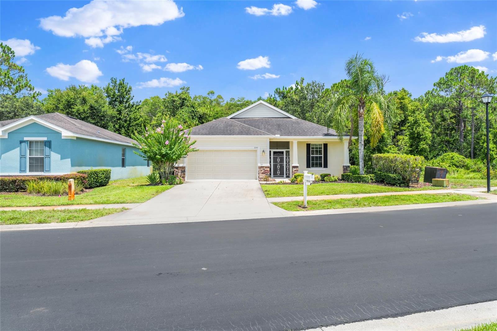 One or more photo(s) has been virtually staged. Welcome to this freshly painted and meticulously maintained 4-bedroom, 2-bathroom DR Horton-built home located on a PREMIUM CORNER & CONSERVATION LOT with serene conservation views in the sought-after 55+ community of Summertree in New Port Richey. Offering 1,873sq ft of thoughtfully designed living space, this home combines comfort, style, and low-maintenance living. This bright and airy split floorplan, is perfect for both privacy and entertaining. The spacious kitchen features granite countertops, stainless steel appliances, an eat-in dining area, and a breakfast bar, ideal for casual dining or hosting friends. A separate laundry room for added convenience. The Primary Suite is a relaxing retreat with a generous walk-in closet and a nicely updated en-suite bathroom. Three additional bedrooms provide plenty of space for guests, hobbies, or a home office. Enjoy Florida living year-round on the large rear newly screened lanai, complete with elegant pavers, a ceiling fan and a charming swing—all overlooking tranquil conservation area with no rear neighbors. Additional features include a 2-car garage, lush landscaping and access to all that Summertree provides residents. Residents enjoy a vibrant lifestyle with a clubhouse, fitness center, sauna, craft and card rooms, library, ballroom, and a host of outdoor amenities including two heated pools, tennis, shuffleboard, and scenic walking trails. Golf enthusiasts will appreciate the Summertree Golf Club, with a 9-hole course, driving range, and pro shop. Don't miss your opportunity to live in one of the area's most desirable 55+ communities—schedule your private showing today!