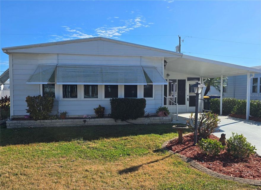 Enjoy your morning coffee while taking in the beautiful sunshine in this spacious 21'10" x 11' lanai. This is a turnkey ready home for immediate occupancy. It was newly updated as well as freshly landscaped. It shows well and is in great condition. There is also a 2 car carport which measures 13'11" x 18' and is 9 ft tall. In the rear of the house there is also a shed. The laundry is in the utility/workshop room which is right off the lanai.