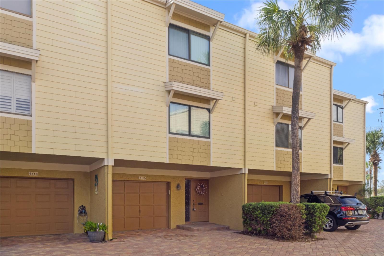 Discover this charming 2-bedroom, 2.5-bathroom townhouse located in the desirable Village of Paradise Island community on Treasure Island. This 1,750 square foot home sits in a prime beach location, just a short walk from the sandy shores and minutes from downtown St. Petersburg's vibrant dining and entertainment scene.
Step inside to find a welcoming tiled foyer that opens to a spacious living area featuring vaulted ceilings and a cozy wood-burning fireplace. The large eat-in kitchen offers plenty of counter space and includes a convenient walk-in pantry for all your storage needs. A bonus room off the garage provides extra flexibility for your lifestyle.
Both the primary and guest bedrooms come with their own ensuite bathrooms and access to a large lanai, perfect for enjoying Florida's beautiful weather. Recent updates include a new water heater installed in 2024 and new air handlers from October 2024, ensuring reliable comfort year-round.
The Village of Paradise Island community enhances your lifestyle with two community pools, fishing docks, and boat slip rentals available. This pet-friendly neighborhood creates the perfect balance of relaxation and recreation opportunities.
The location offers the best of both worlds - peaceful beach living with easy access to St. Petersburg's attractions. Whether you want to spend your day fishing from the community docks, lounging by the pool, or exploring the city's shopping and dining options, everything is within reach. This townhouse presents an excellent opportunity to embrace the Florida coastal lifestyle in a well-maintained community setting.
