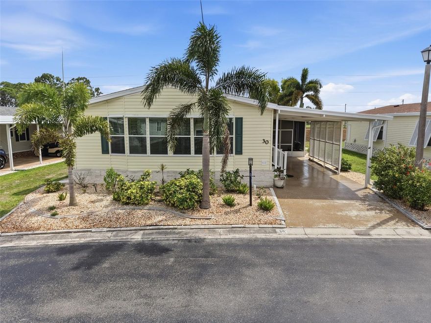 This impeccably maintained and move-in-ready manufactured home, built in 2005, offers affordable living and peace of mind in a desirable, amenity-rich community located in a non-flooding zone. Recent high-ticket upgrades include a new roof installed in 2023, along with an A/C unit and refrigerator that are both approximately three years old. The interior is bathed in natural light from two skylights and features premium finishes such as crown molding, multi-panel doors, and stylish plantation shutters throughout. Designed for convenience and security, the home includes an indoor washer and dryer, hurricane shutters, and a spacious carport with room for two vehicles. Residents also benefit from a community storage lot for boats or RVs. Perfectly situated for the Florida lifestyle, this property is just three miles from Burnt Store Marina and six miles from Punta Gorda, providing easy access to world-class boating, dining, and everyday essentials.