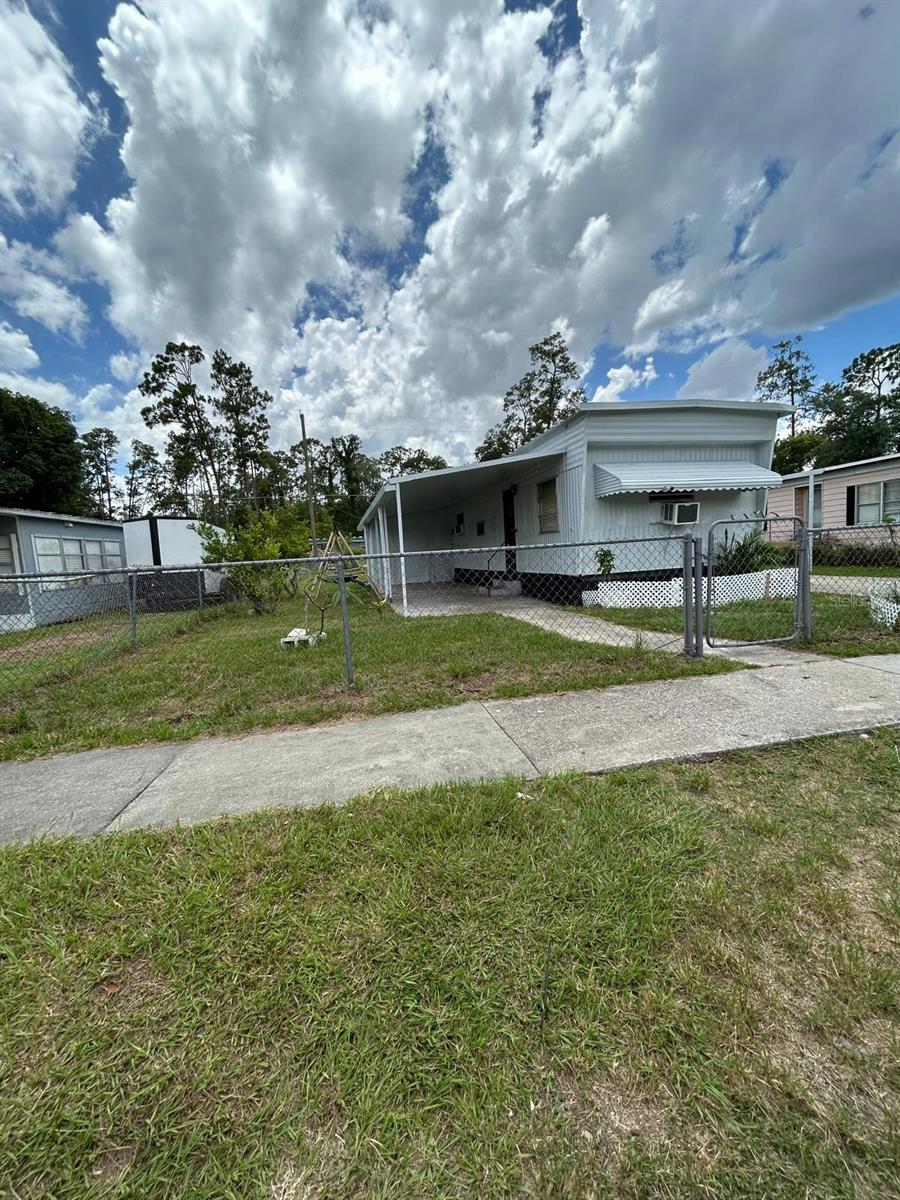 Just Listed 2 Bedroom /1 Bath Mobile home with large Lot! located in the Heart of Orlando. Close to Airport (OIA)This property offers a comfortable living room and cozy eat-in kitchen with great cabinet space and ample room for food prep and storage. The spacious master bedroom is located at the rear of the home and offers a peaceful retreat with quiet backyard. The second bedroom is ideal for guests or a home office. The bathroom offers a nicely sized vanity with ample cabinet space, shower/tub combo & built-in storage for linens & towels. Situated on an oversized lot, this home has a covered carport and an additional covered patio space perfect for relaxation and entertaining! Also conveniently situated for easy accessibility is a great storage room with washer/drawer and great space for extra storage.