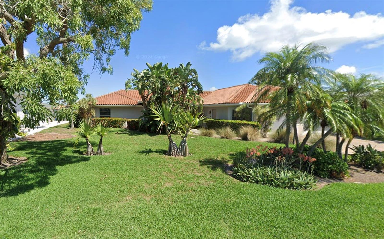 This expansive lot boasts 100 feet of waterfront on an extra-wide canal, offering endless potential for your dream home. With its generous size and stunning water views, this property is perfect for creating a custom coastal retreat. Newer seawall. Sold at lot value.