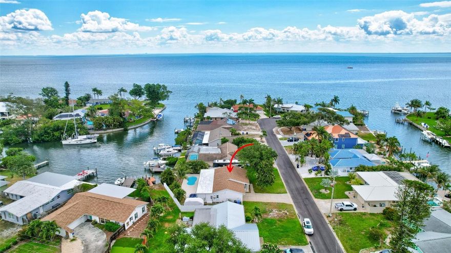 One or more photo(s) has been virtually staged. Welcome to Coquina Key, the best neighborhood in the world, period. This is the kind of opportunity buyers wait for, and when it hits the market, it does not sit still. This 3-bedroom, 2-bath waterfront home stands out in all the right ways, not just because of what it offers, but because of how it compares. Inside, you’ll find an open, inviting floor plan that lives exactly how today’s buyers want it to. The primary suite feels like a true retreat, featuring an oversized dressing room that feels more like a luxury boutique than a closet and a bathroom where the large walk-in shower becomes the focal point, featuring original tile work and unique design that give the space character and charm you simply do not see every day. The kitchen is absolutely loaded with the upgrades buyers expect in a luxury waterfront home. Featuring a premium Sub-Zero refrigerator, high-end appliances, custom cabinetry, an oversized island, designer backsplash, endless prep and entertaining space, plus a butler’s pantry with a dedicated coffee bar, this kitchen was designed for both everyday living and hosting on a larger scale. Whether it’s morning coffee before heading out on the boat, wine nights with friends, or holiday gatherings, this space delivers both style and substance with no detail overlooked. Step outside and the lifestyle only gets better. Waterfront living with your own boat lift means easy access to Tampa Bay in minutes, while the pool and hot tub create the perfect private backyard retreat. Imagine sunset evenings in the spa, weekends entertaining by the water, or simply relaxing surrounded by tropical landscaping with the feeling of being on vacation every single day. This is the kind of outdoor setup buyers dream about. Located just 3.5 miles from vibrant downtown St. Petersburg and a short drive to some of the most beautiful Gulf beaches, you’ll have the best of both worlds: peaceful island living with convenient access to everything. When you start comparing features, upgrades, and overall lifestyle, it becomes obvious this home is playing in a different league. And then there’s Coquina Key itself. A true lifestyle neighborhood with a community park offering active pickleball, tennis, basketball, soccer fields, a waterfront walking track, two dog parks, movies in the park, neighborhood picnics, and the beloved annual Christmas parade. It’s the kind of place buyers wait for and compete for. That’s the reality here. Buyers are watching this neighborhood closely, and homes that feature this level of completeness do not sit around. If you’ve been waiting for the one that actually makes sense, not just emotionally, but financially, this is it. Move quickly.