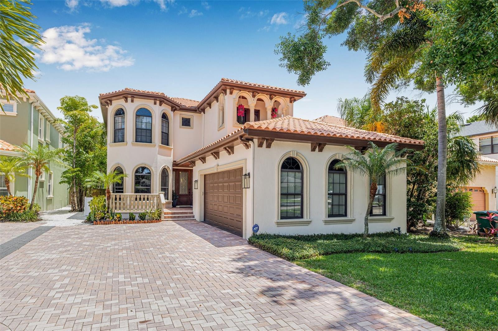Welcome to this stunning Spanish style gem in sought after Ballast Point, where style, function, and location come together perfectly. Built in 2007 with block construction and a classic barrel tile roof, this 4 bedroom (+ Office + Play room), 3.5 bath home offers over the top features that today’s buyers crave. Inside, you’ll find wood and ceramic tile flooring throughout, solid core interior doors, coffered ceilings, crown molding, and walk-in closets in every bedroom, all located on the second floor for convenience. The spacious primary suite boasts a massive walk-in closet and spa-like bath, while a separate office and game or playroom provide flexibility for your lifestyle. Enjoy peace of mind with 2023 dual HVAC systems, a Generac whole home generator, and a reverse osmosis water system. Love the outdoors? This backyard is next level with an Ultra Customs pool/spa, xeriscape landscaping, artificial turf, tropical privacy, and even an automated retractable awning and invisible screens for all-season comfort. The oversized two car garage easily fits SUVs, with storage racks and space for a home gym. Additional highlights include a butler’s pantry, upstairs laundry room, pavered driveway, front yard irrigation, and an exterior bug misting system. Tucked in a walkable pocket of Ballast Point just steps from Tampa Yacht and Country Club, Bayshore Boulevard, parks, and restaurants, this home checks every box and then some. Come experience the difference.