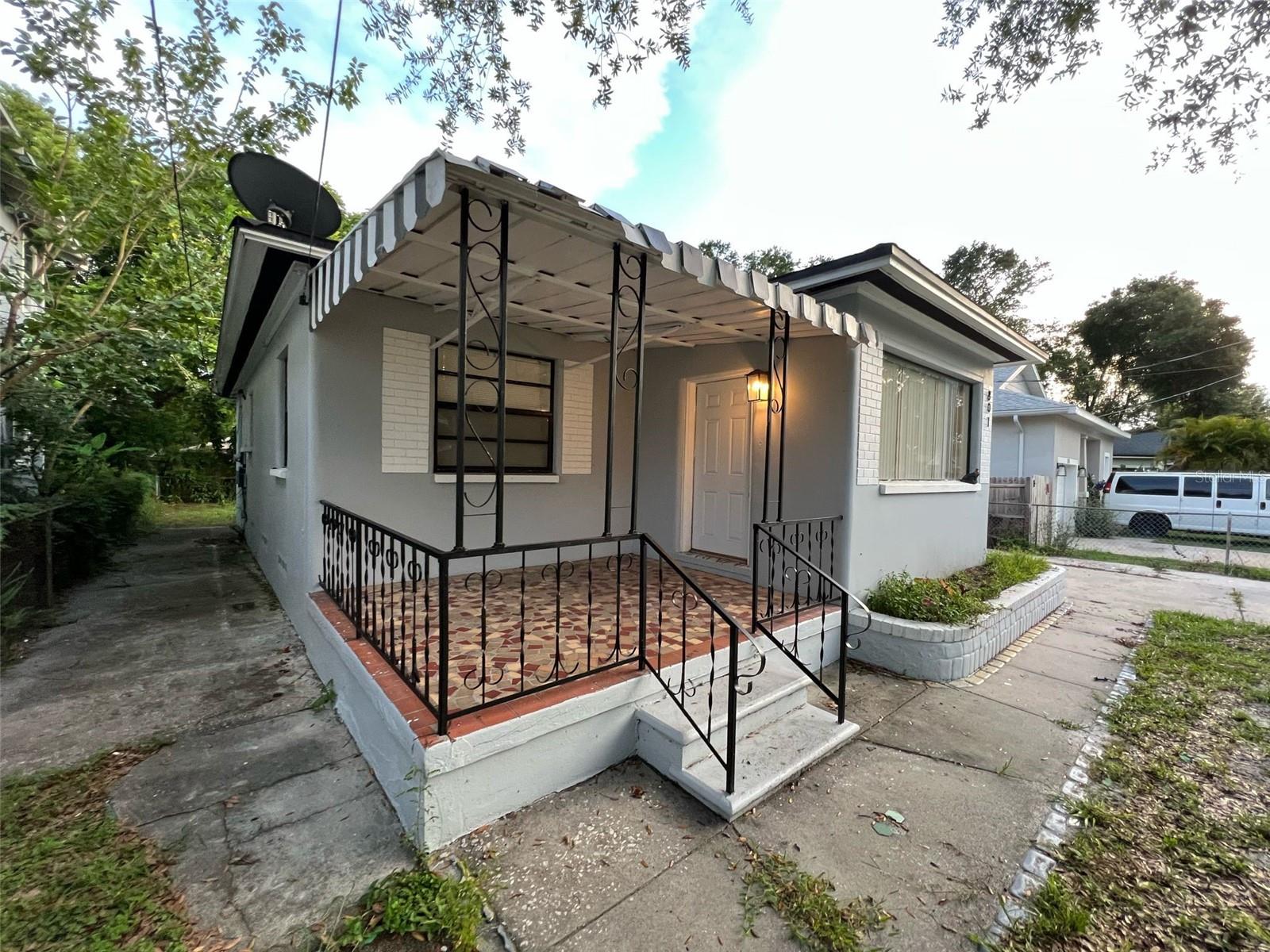 Fully remodeled and move-in ready, this charming 2-bedroom, 1-bath single-family home in Tampa’s Seminole Heights offers 1,064 square feet of upgraded living space. The interior features modern tile flooring throughout, a beautifully updated kitchen and stainless steel appliances, and a refreshed bathroom with contemporary fixtures. The home also includes ceiling fans, ample natural light, and washer/dryer hookups. Outside, enjoy a fully fenced yard, a private driveway, and a 2-car covered carport. Conveniently located near major highways, shopping, dining, and just minutes from downtown Tampa, this property offers both comfort and accessibility. Available now!