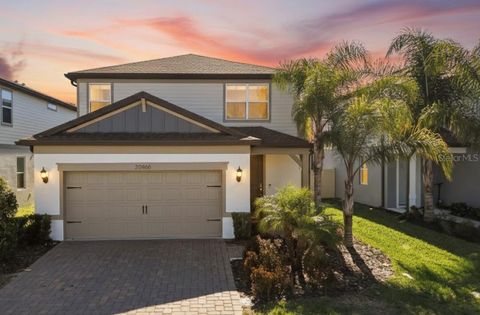 Photo of 20466 Monza Loop, Land O Lakes, FL 34638 (MLS # TB8472565)