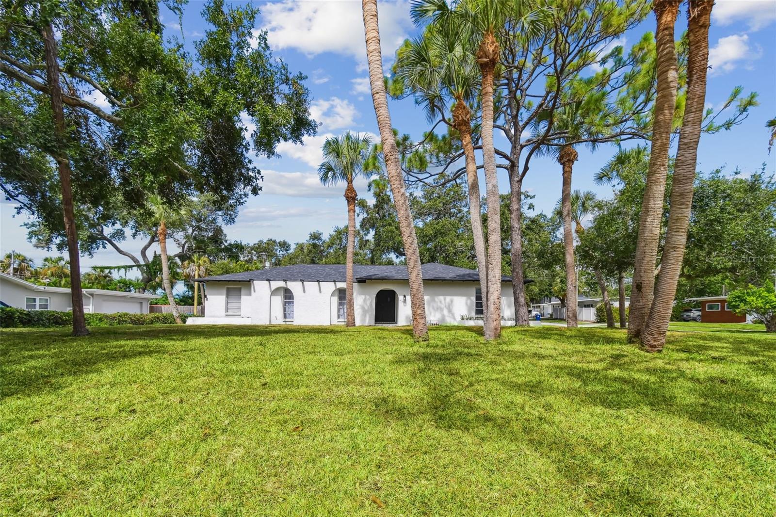 HIGH AND DRY... Experience the perfect blend of luxury living and family comfort in this spectacularly and completely remodeled 4-bedroom, 3-bath home, ideally situated on an oversized corner lot that has remained high and dry—no flood concerns here. From the moment you enter, you’ll be impressed by the spacious open floor plan, enhanced with decorative lighting, rich modern cabinetry, stainless steel appliances, and an extra-large stone center island—a dream space for cooking, entertaining, and everyday living. In addition, a beautiful Florida style remodeled and tiled Sunroom with pass thru kitchen access opening directly to a patio and newly fenced private family spaced expansive back yard recently fully sodded.
The primary suite serves as a private retreat with a fully remodeled spa-style ensuite bathroom, dual vanities, walk-in shower, and expansive walk-in closets. Two additional bedrooms are connected by a well-designed Jack-and-Jill bathroom, perfect for children, guests, or multi-generational living. A third stand alone bedroom completes our picture. French-style sliding doors lead out to a peaceful, fully fenced backyard—featuring brand-new vinyl fencing, fresh seasonal sod, and a refurbished irrigation system, ideal for entertaining or unwinding in privacy. A spacious two-car garage adds practicality and secure storage.
Beyond the home itself, this property offers an unbeatable location. Just minutes from Maximo boat slips, ramps, rentals, and peaceful waterfront walkways, grilling or just feeding the squirrels. You’ll enjoy a true coastal lifestyle. Access to Tampa International and St. Pete–Clearwater airports is quick and convenient, as is the nearby I-275 for easy commuting north or south. Spend your weekends just moments away from the world-renowned St. Pete beaches, Pass-a-Grille, exclusive restaurants, beach bars, comedy clubs, entertainment venues, and local pubs.
Families and professionals alike will appreciate the proximity to two renowned hospitals, excellent shopping, and the peaceful charm of Pinellas Point—a hidden gem offering serenity and community. Whether you're raising a family or looking for refined comfort near everything the Gulf Coast has to offer, this exceptional home delivers the best of Florida luxury and lifestyle.