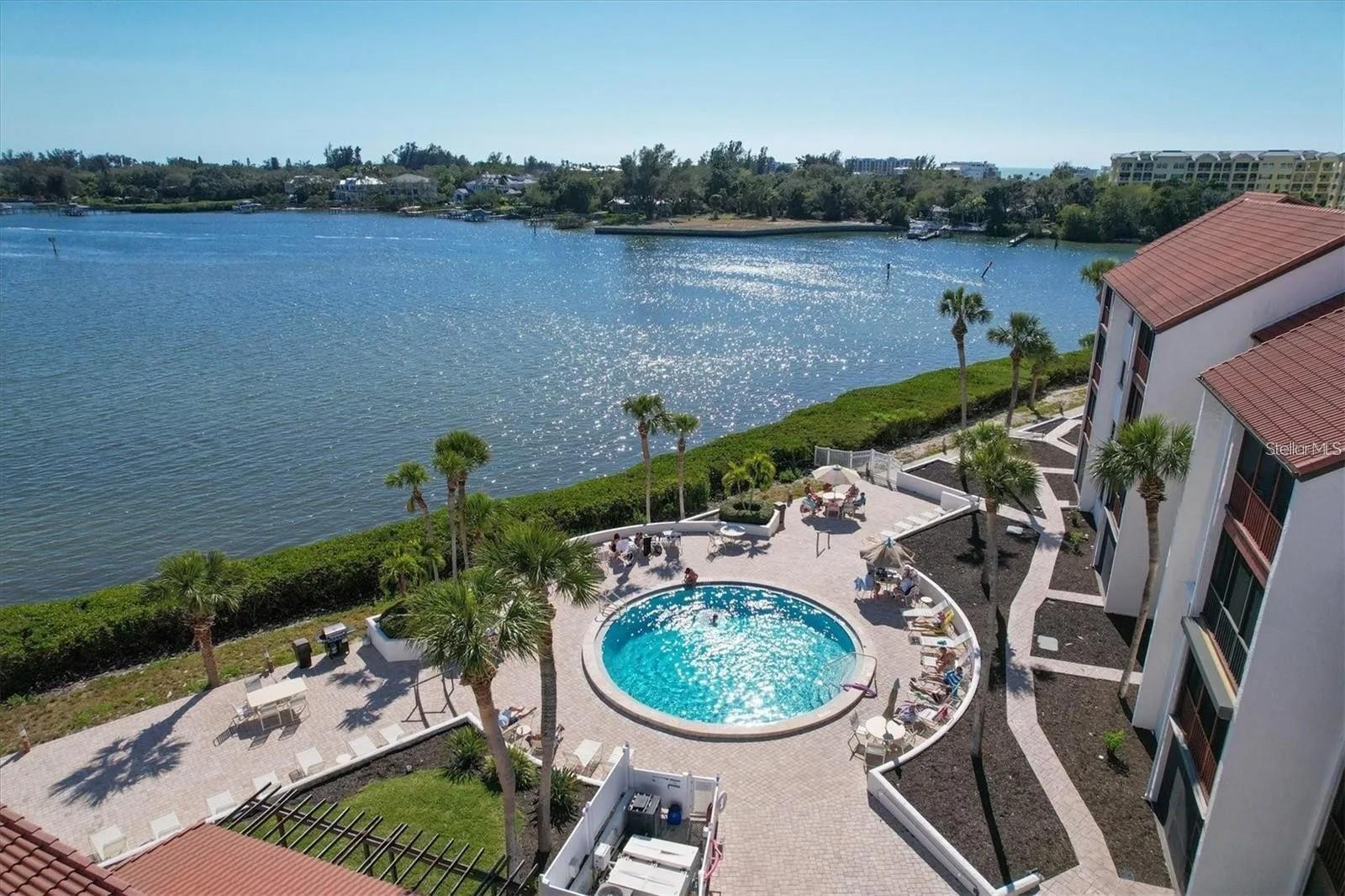 AVAILABILITY: May, June, July, August 2025: $2,000/month plus fees & taxes September & October 2025: $2,400/month plus fees & taxes Discover the epitome of coastal living in this inviting 2-bedroom 1st floor condominium, strategically nestled just steps away from one of two heated pools, offering an ideal blend of comfort and convenience. This resort-style community, ideally located on the Intracoastal Waterway offers two pools, one of which is situated right on Sarasota Bay, providing breathtaking water views and sunsets. Additional amenities include a bayside gazebo, kayak racks and launch area, tennis courts, pickleball courts, shuffleboard, and a boardwalk that surrounds the bay area. The master bedroom boasts a luxurious ensuite bathroom and a queen-sized bed, while the second bedroom features two full beds and generous closet space. The well-appointed kitchen seamlessly flows into the cozy living area. Adding to the allure is the proximity to essential amenities - a quick 12-minute walk to the pristine Siesta Key Beach and a mere 10-minute stroll to dining, shopping, jet ski rentals, and more. Immerse yourself in the vibrant island lifestyle with the option to bike to Siesta Key Village or take the Free Trolley after a leisurely walk over the bridge.
The laundry room is conveniently just steps away. Leave your car behind and embrace the freedom of walking everywhere. Seize the opportunity to make this slice of paradise your own. Monthly rates vary on seasonal months, please inquire for accurate pricing