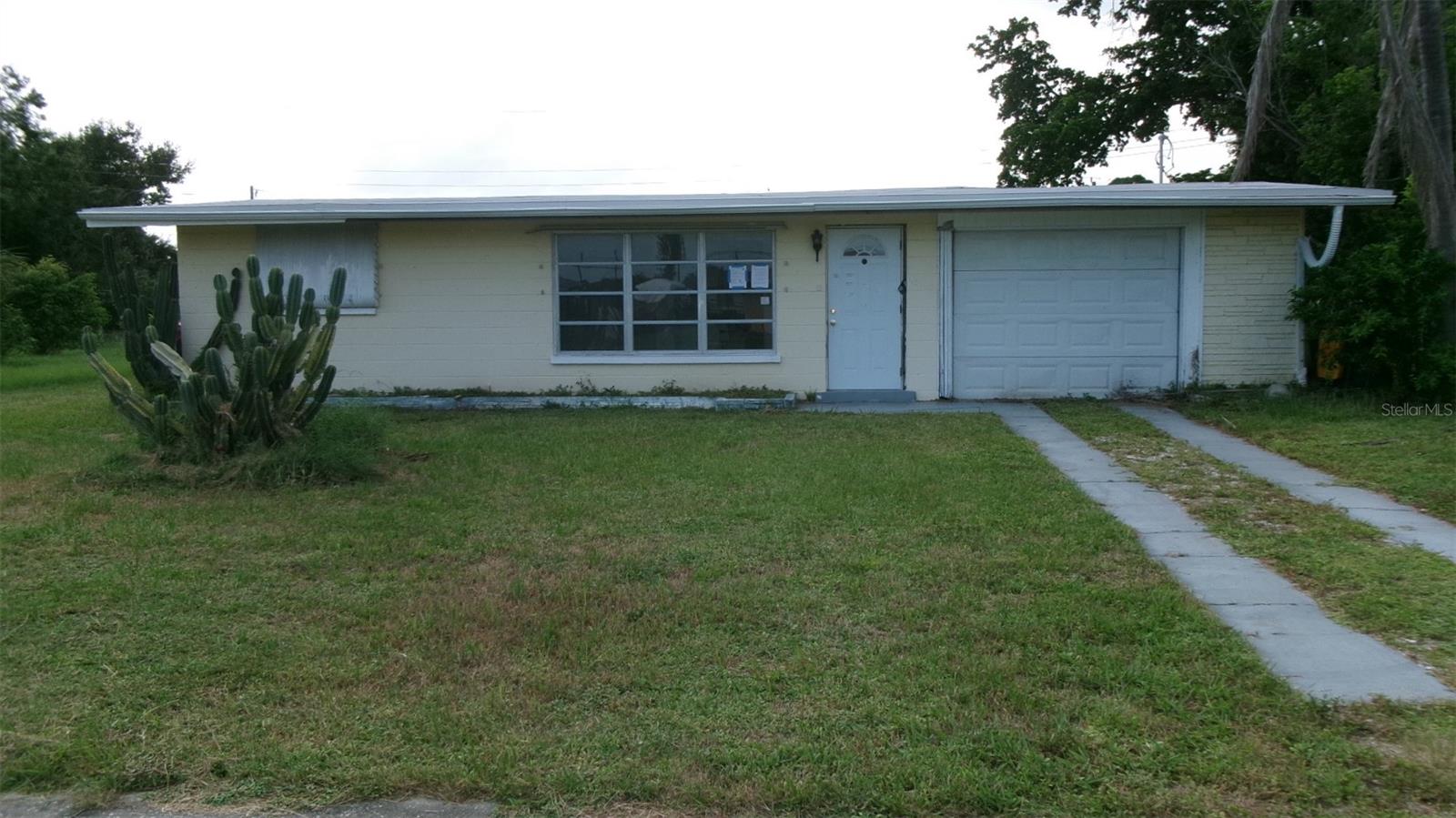 2-bedroom, 1-bath home on an oversized lot. With a little TLC, this property can be brought back to its full potential. Great for a retirement home or family home. Large windows fill the space with Florida sunshine, and a spacious kitchen. The large dining area can serve as a bonus room or great room, and the den was used as a TV room; it could be a possible 3rd bedroom. Enjoy a generous backyard with a sitting area perfect for relaxing or BBQs. The extended garage includes a workshop space. Conveniently located near US-41, shopping, dining, and just minutes from Port Charlotte Beach Complex and boat ramp. Recent updates include a new permitted water heater (8/2024). The sheetrock on the ceiling had been damaged due to an old roof leak. The sheetrock has been removed and is ready for the new owners to have it replaced.
FHA Case # 095-542190: Property available for Owner Occupants, Nonprofits & Govt Agencies only, first. IN (Insured) 203K Eligible. FHA $100 Down Eligible. Sold AS IS. See docs for disclosure. Information not guaranteed. Equal Housing Opportunity. The buyer pays all transfer fees, doc stamps, and title insurance. The buyer is responsible for utilities during inspections.