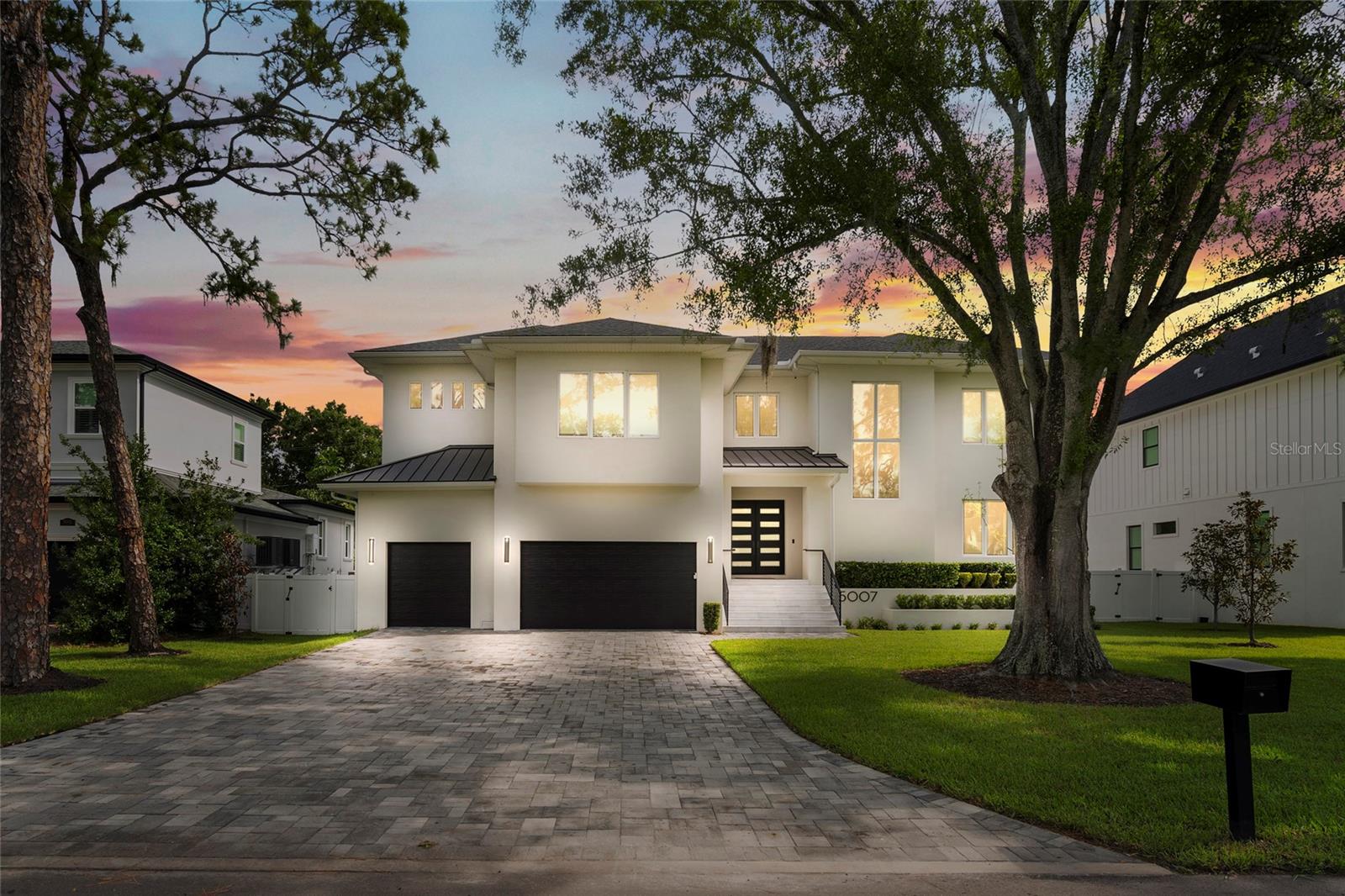 Nestled in the heart of South Tampa’s highly desirable Sunset Park neighborhood, this stunning custom-built home offers luxurious living on a premium 95x110 lot. Completed in 2022, the 5,217 sq ft residence features 5 bedrooms, 4 full bathrooms, and 2 half baths. A grand foyer welcomes you into a thoughtfully designed layout that includes a private study, a spacious guest suite with Lanai access, and a large family room with a wet bar and sliding glass doors that open to a covered lanai. The gourmet kitchen is a chef’s dream, outfitted with Thermador appliances, quartz countertops, 42” cabinets, a walk-in pantry, and an adjacent mudroom with custom built-ins.
Upstairs, the luxurious owner’s suite offers a spa-like retreat with a freestanding tub, oversized walk-in shower, and an expansive custom walk-in closet. Three additional bedrooms, each with walk-in closets, share the upper level along with a large movie/game room complete with a wet bar and beverage fridge. The outdoor living space is equally impressive, featuring a travertine-covered lanai with tongue-and-groove ceiling, a fully equipped outdoor kitchen, and a resort-style pool and spa surrounded by lush landscaping and a fenced backyard. Additional highlights include a three-car garage, smart home wiring, and zoning for the highly rated Plant High School. This home perfectly combines elegant design, functional living space, and premier location.
