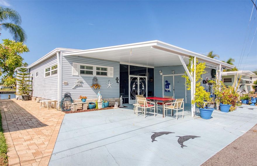 THIS UNIQUE TRIPLE WIDE THREE BEDROOM TWO BATH WATERFRONT HOME WITH DOCK is move in ready. Come watch the manatees and dolphins swim by this meticulously maintained home. There is plenty of waterfront outdoor living space watching various forms of wildlife just a few yards away. The owners have replaced the paneling with drywall and a remodeled bathroom. They have a newer traditional air conditioner and a retractable awning with lighting and so many other features. Don't miss this exceptional waterfront opportunity within the sought-after Bay Aristocrat Village! This premier Pinellas County waterfront manufactured home community offers the unique benefit of property ownership, not renting, within an active age 55 and over retirement setting. Enjoy leisurely afternoons by the heated pool and Jacuzzi, stay active with friendly games on the shuffleboard courts, and participate in varied scheduled activities at the clubhouse. With two fishing piers right on Tampa Bay, waterfront enjoyment is always at your fingertips. Benefit from a low monthly maintenance fee of only $360, which conveniently covers lawn care, trash removal, water, and sewer services. Bay Aristocrat Village is ideally located just minutes from world-famous Clearwater Beach, upscale shopping malls, diverse restaurants, major hospitals, and two international airports. Please note that only one cat per home is allowed, and no dogs are permitted. Contact the community office regarding (ESA) pets. This is your chance to embrace the coveted Florida waterfront lifestyle. Schedule your private showing today to experience the Bay Aristocrat Village lifestyle firsthand and envision yourself living the warm, beautiful Florida waterfront dream!"