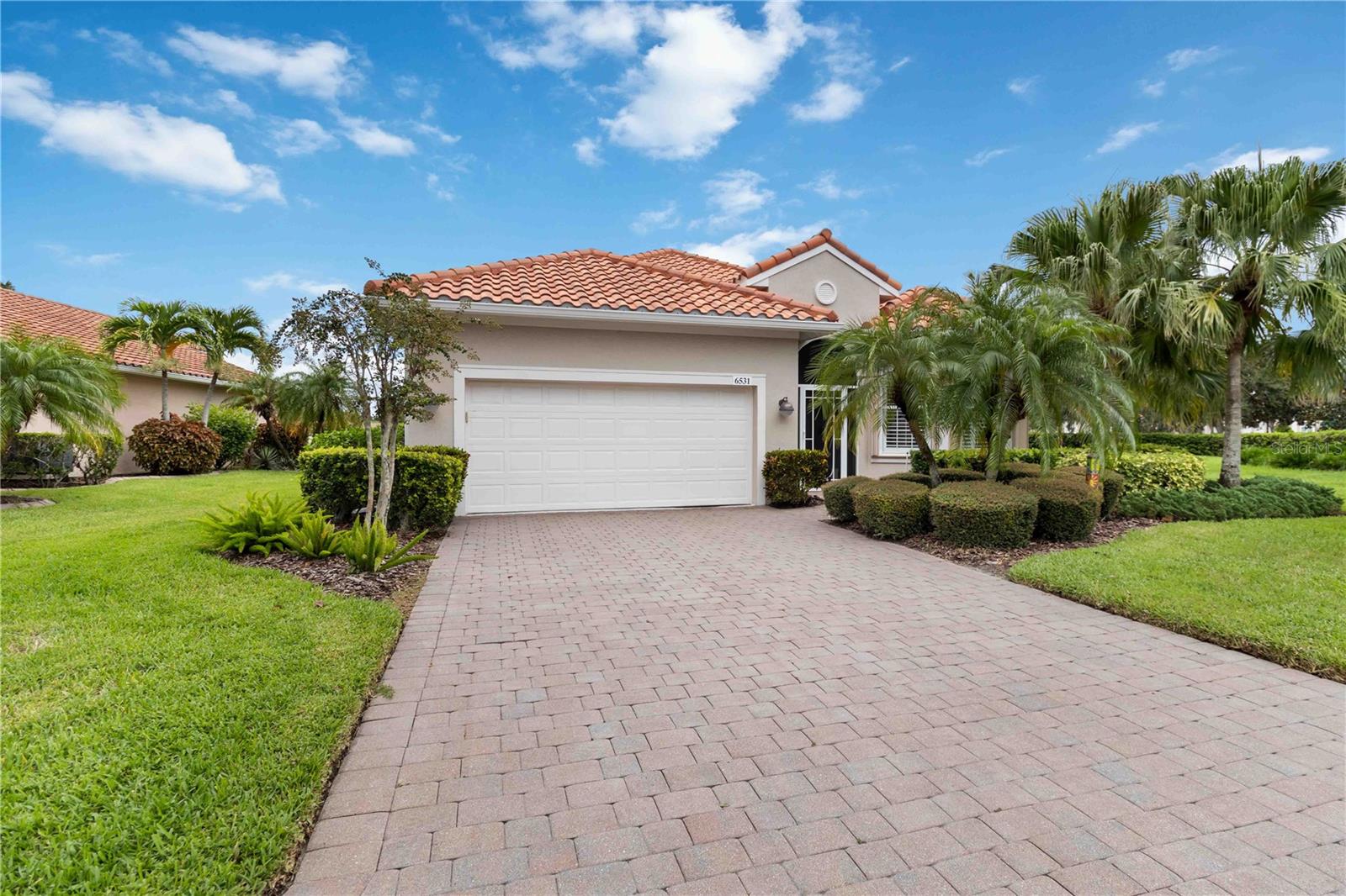 Welcome to this beautifully updated and maintained three-bedroom home in the sought-after Cascades at Sarasota, an active 55+ community offering resort-style amenities. This spacious residence features a private pool with wide lake views. The pool was resurfaced with new paver decking, fully re-screened about two years ago, and enhanced with a new heater and pump in 2024, making it ideal for year-round enjoyment. At the entry, a new hurricane-rated glass front door is paired with a screened enclosure for a welcoming touch, while the exterior was freshly painted in 2023. Inside, the home has been thoughtfully updated with a freshly painted interior in 2020, plantation shutters, tile flooring in the main living areas, and laminate in the bedrooms. The kitchen showcases refaced and professionally painted cabinetry, granite counters, and stainless steel appliances, all replaced in 2020 and the oven and microwave replaced in 2022. Both bathrooms were fully updated in 2020, with the master tub refaced in 2024, and mirrored closet doors have been added in the 2nd and 3rd bedrooms. Additional highlights include an laundry room with cabinets and sink, a garage floor coating completed in 2023, and a new hot water heater installed in 2024.
Cascades at Sarasota is a gated, maintenance-free community that offers an exceptional lifestyle with a 25,000 square foot clubhouse, indoor and outdoor heated pools, fitness center, sauna, tennis and bocce courts, and a variety of clubs and activities organized by a full-time lifestyle director. Conveniently located near the University Town Center, Sarasota–Bradenton Airport, I-75, and just a short distance to downtown Sarasota and area beaches, this home combines comfort, convenience, and resort-style living in one of Sarasota’s most desirable active adult communities. All information provided by the sellers is deemed reliable but is not guaranteed. Buyers are encouraged to verify all information independently.