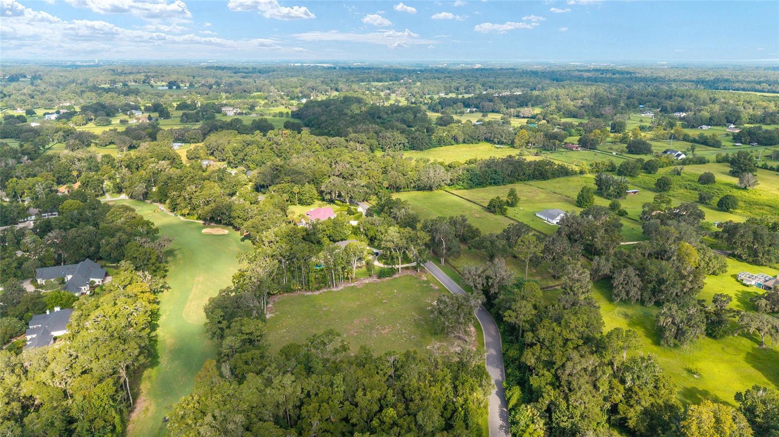 Here’s your chance to create something truly special in the Country Club of Ocala. This 2.11-acre lot is one of the biggest and one of the last lots in the neighborhood, and it’s already cleared and ready for your dream home. Set on a rolling hill with views of the 12th hole, the property offers a beautiful backdrop and plenty of room for whatever you imagine, a pool, gardens or just wide-open space to enjoy. Take advantage of this rare find that’s ready and waiting for your vision and enjoy peace and privacy, all while being part of a beautiful golf course community with easy access to Ocala’s shopping, dining, equestrian venues, and medical.
