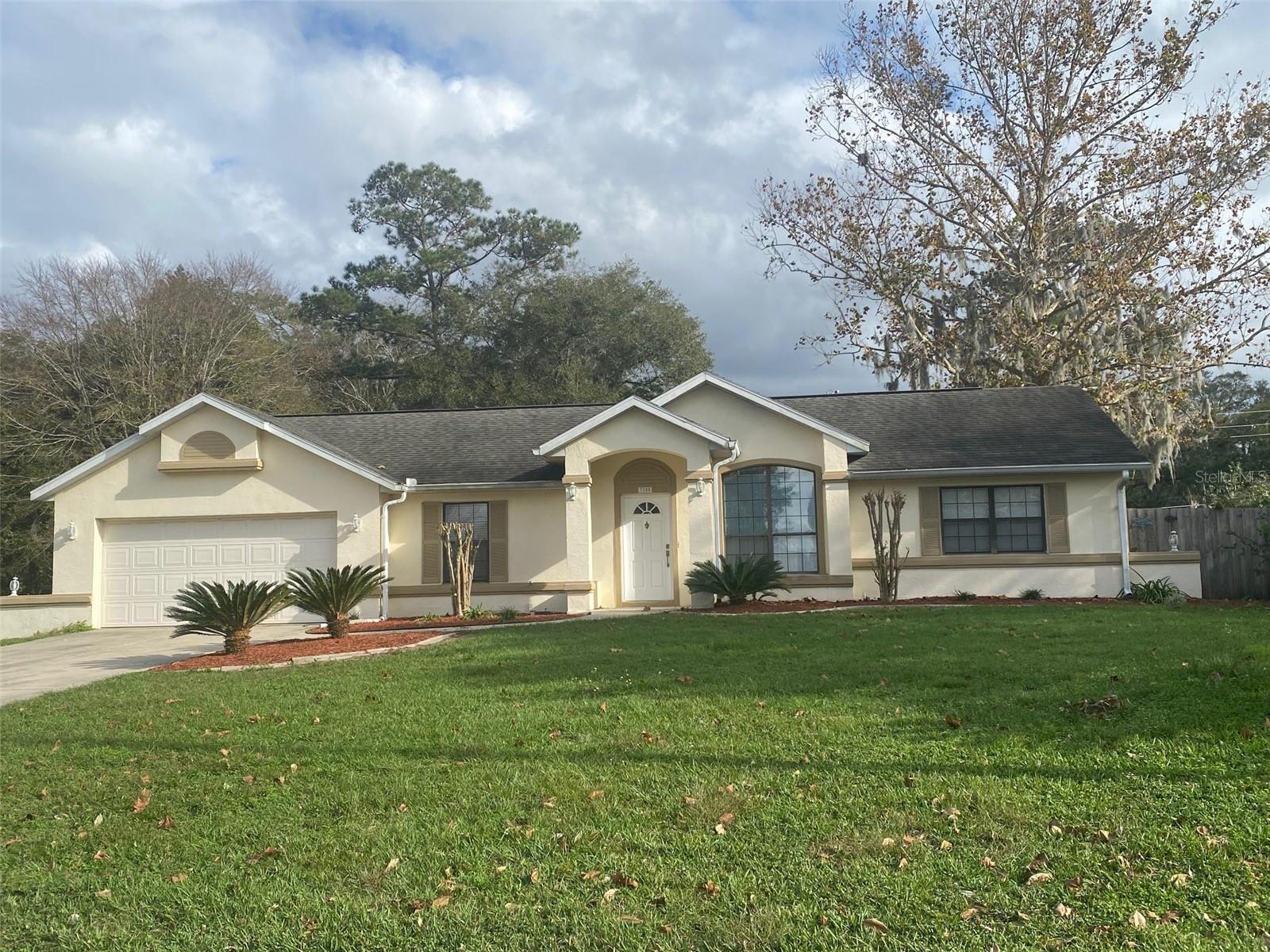 This 1,412 sf home features 2 bedrooms, 2 bathrooms, a large living room, as well as a spacious family room with fireplace. Enjoy the cathedral ceilings and roomy master bath. The kitchen features many cabinets for plenty of storage along with counter space. Park both of your cars in the attached garage. Fenced Yard. Windstream, a rather popular neighborhood, is close to schools, shopping, and hospitals. Centra Ocala Location. This is a bright, cheerful house and it is a pleasure to see.