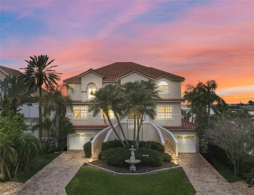 Welcome to your waterfront oasis in the heart of Dunedin, Florida, where luxury living meets the serene beauty of coastal living. This three-story home, spanning an impressive 3,900 square feet, beckons you with its captivating charm and stunning water views from every level.

As you ascend the steps to the front door, the allure of this boater's paradise becomes immediately evident.   Step onto the main floor and immerse yourself in the spacious elegance of the den, kitchen, family room, dining room, living room, and laundry room, all thoughtfully designed for both relaxation and entertainment. 

Meanwhile, the third floor offers a tranquil retreat with the primary bedroom boasting its own balcony access and breathtaking water vistas. Two additional bedrooms with balcony access and a tucked-away fourth bedroom complete the upper level.  With a total of 3.5 baths, including a luxurious ensuite in the primary bedroom, comfort and convenience abound.

Descending to the ground level, prepare to be enchanted by your private entertainer's paradise. Here, a bar, billiards table, additional bedroom, and office await, promising endless possibilities for gatherings and leisure. Dual two-car garages offer ample parking and storage, effortlessly accessed from this level.

Venture outside to your covered lanai and immerse yourself in the ultimate outdoor sanctuary. The sparkling pool and spa beckon for relaxation, while the almost 90-foot dock provides easy access to the Gulf of Mexico. 

In this waterfront haven, every day feels like a vacation. Honeymoon and Caledesi Island State Parks , known for their pristine sand and blue-green water, are just minutes away and in direct view from the property.