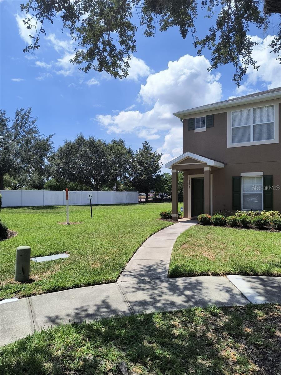 Welcome home to Foxmoor Townhomes at Panther Trace! This established gated community features a desirable end unit with two bedrooms, two and a half bathrooms in. Step inside to a bright and open floor plan with laminate floors leading from the combined living and dining space into the very functional kitchen. Inside the kitchen area, you will find an adjoining powder room and a closet under the stairs. Kitchen cabinets and a closet pantry with bi-fold doors also maximize storage. A serving hatch/bar provides easy access from the kitchen to the dining room. Sliding glass doors open to an enclosed porch and patio ready for outdoor seating and entertaining. The porch also gives access to the townhome’s secured storage unit. The second floor features laminate floors in the hallway and bedrooms. The master bedroom features a walk-in closet and tub/shower combination in the bathroom. The community features a swimming pool and maintenance free living. Right off of U.S. 301, Foxmoor Townhomes is within minutes to restaurants, stores and entertainment. MacDill AFB, downtown Tampa and all that Florida has to show is within your reach.