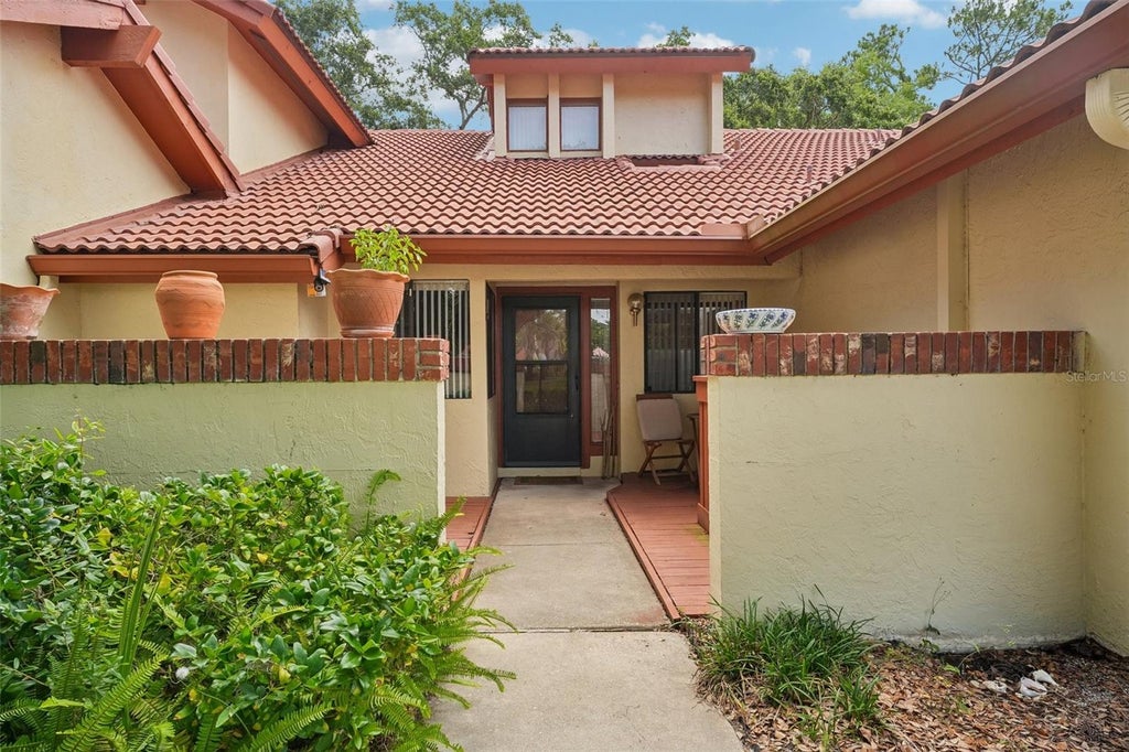 Photo of 67 Village Circle #67, Palm Coast, FL 32164 (MLS # O6433392)